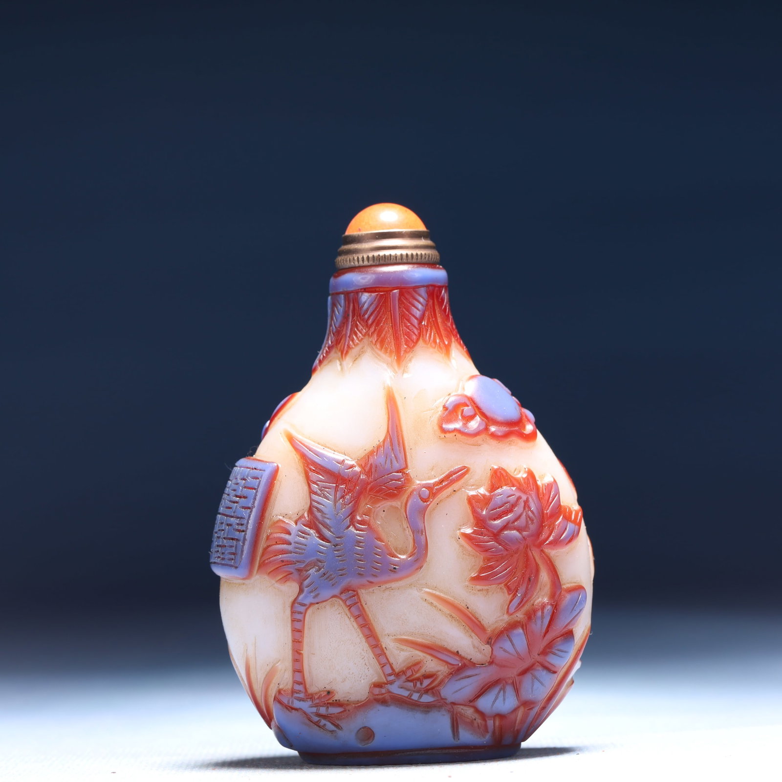 An Exquisite Glass Flower and Crane Pattern Snuff Bottle: An Exquisite Glass Flower and Crane Pattern Snuff Bottle,Qing Dynasty,China,Qianlong Four-character Mark,Size:2inx1.2inx3.1in,Weight:71g