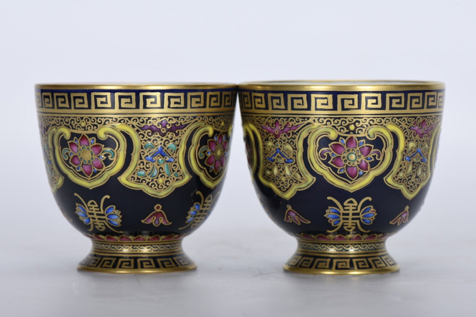 A Pair of Exquisite Ji Blue Glazed Enamel Lotus Pattern Cups (1 of 9)