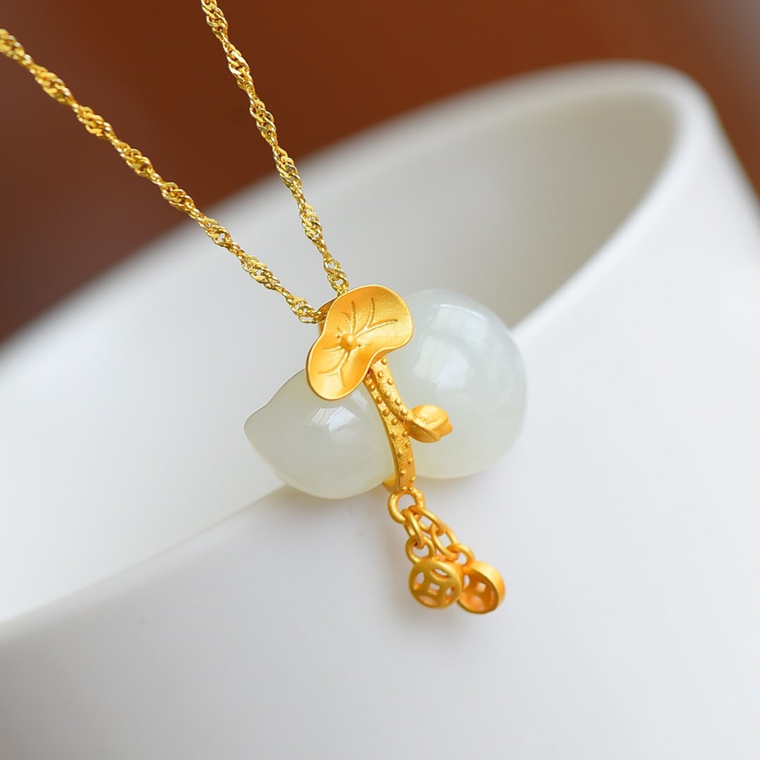 A Pair of Exquisite Sterling Silver-Gold Plated Inlaid White Jade Gourd Necklaces: A Pair of Exquisite Sterling Silver-Gold Plated Inlaid White Jade Gourd Necklace,Size:0.6inx0.9in 一对纯银镀金镶白玉葫芦项໦