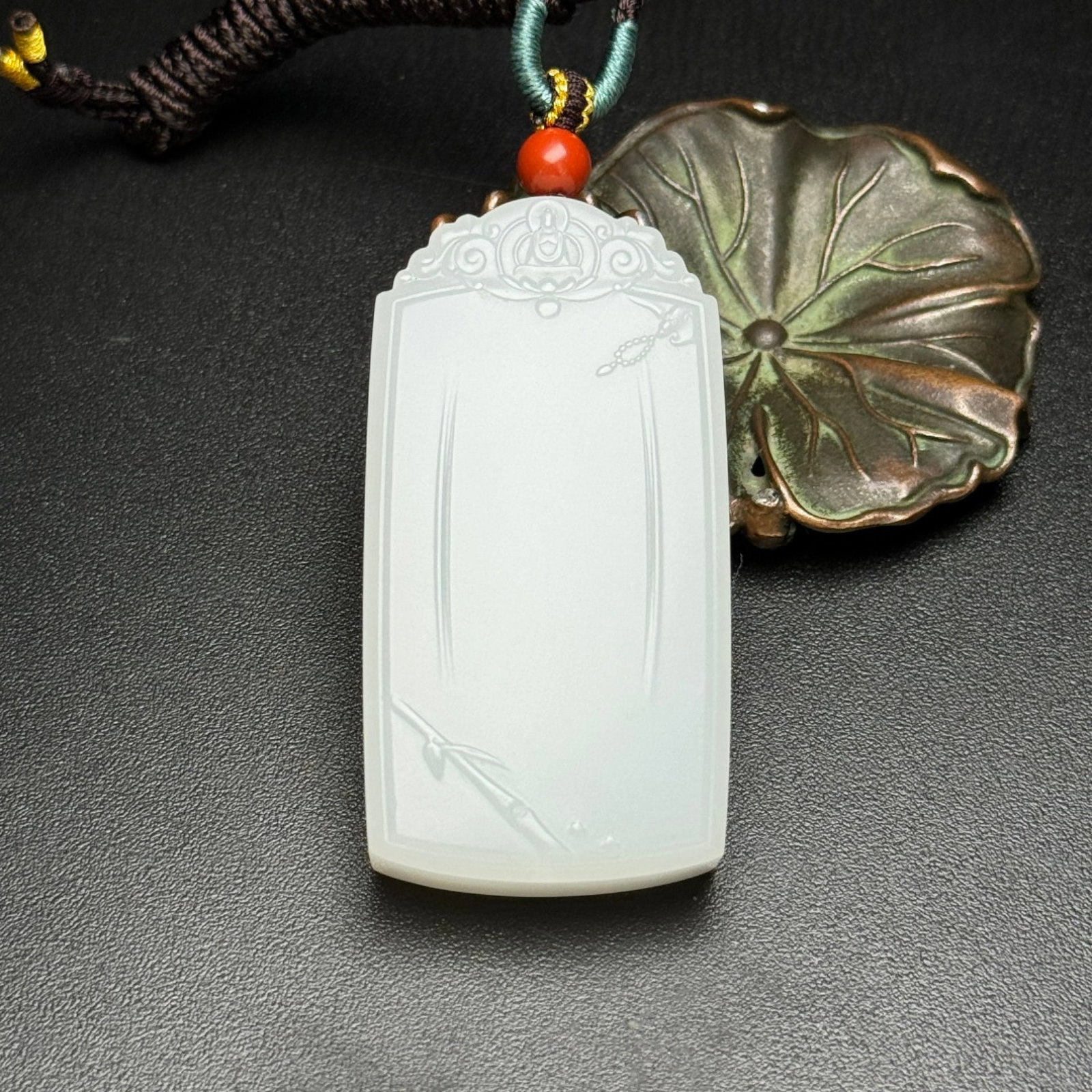 An Exquisite White Jade Pendant: An Exquisite White Jade Pendant,Qing Dynasty,China,Size:1.1inx2.2inx0.5in,Weight:50g 白玉牌,中国清代