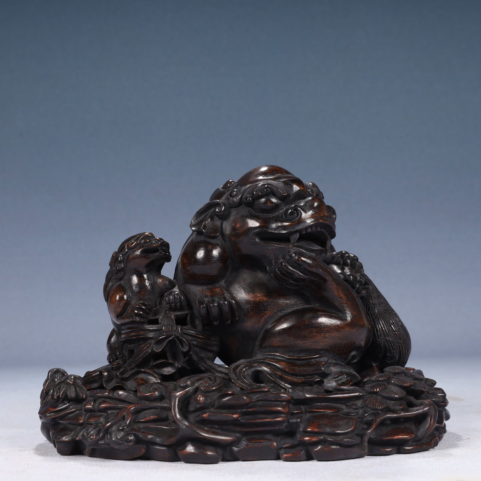 An Exquisite Redwood Lion Ornament,With Base: An Exquisite Redwood Lion Ornament,With Base,Qing Dynasty, China,Size:7.9inx4.7inx5.5in,Weight:600g 沉香木狮子摆件,带底座,中国&#