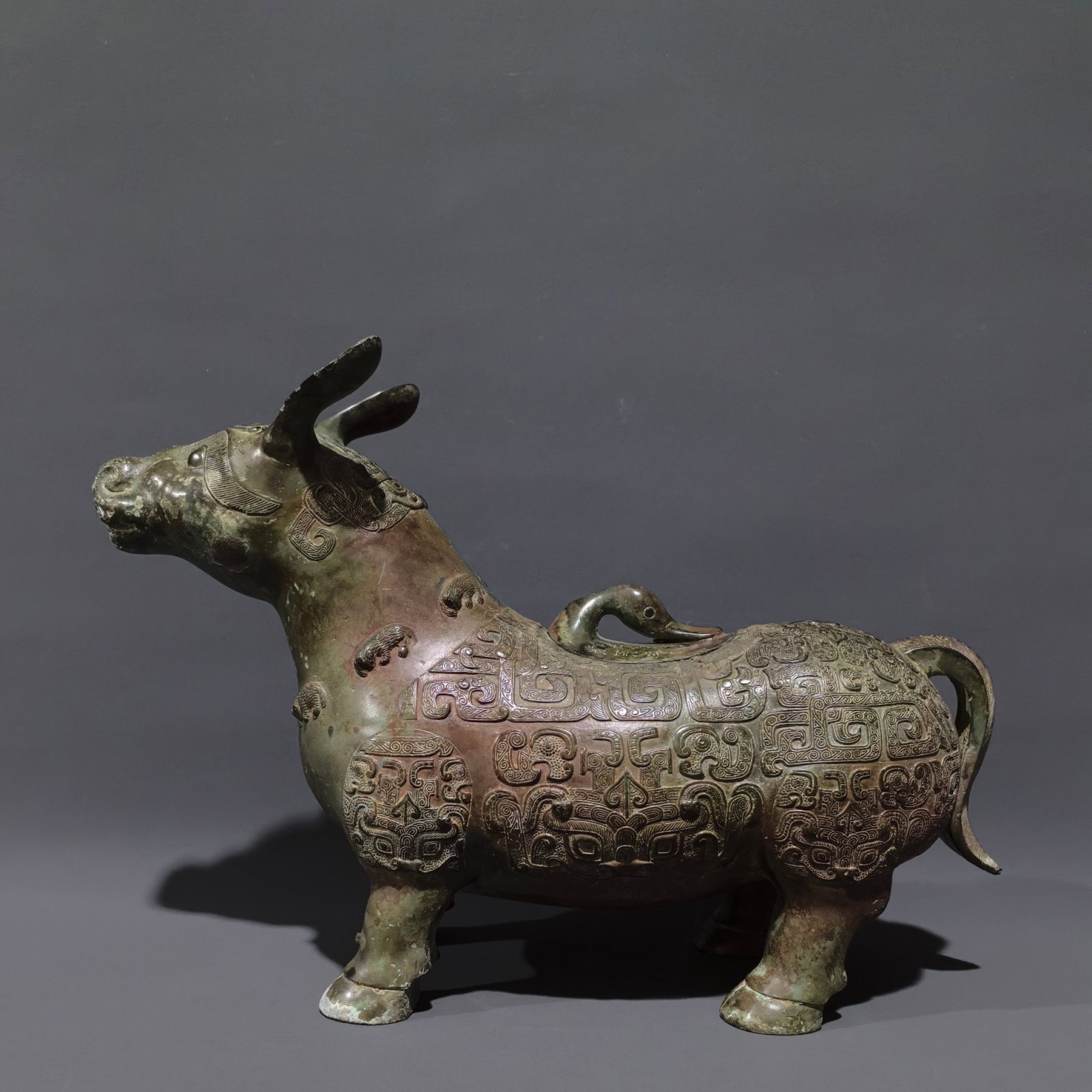 An Archaic Bronze Beast-Face Pattern Beast-Shaped Cup,With Inscription: An Archaic Bronze Beast-Face Pattern Beast-Shaped Cup,With Inscription,Shang and Zhou Dynasty, China,Size:9.8inx15inx5.1in,Weight:3.5kg 中国商周时期兽面