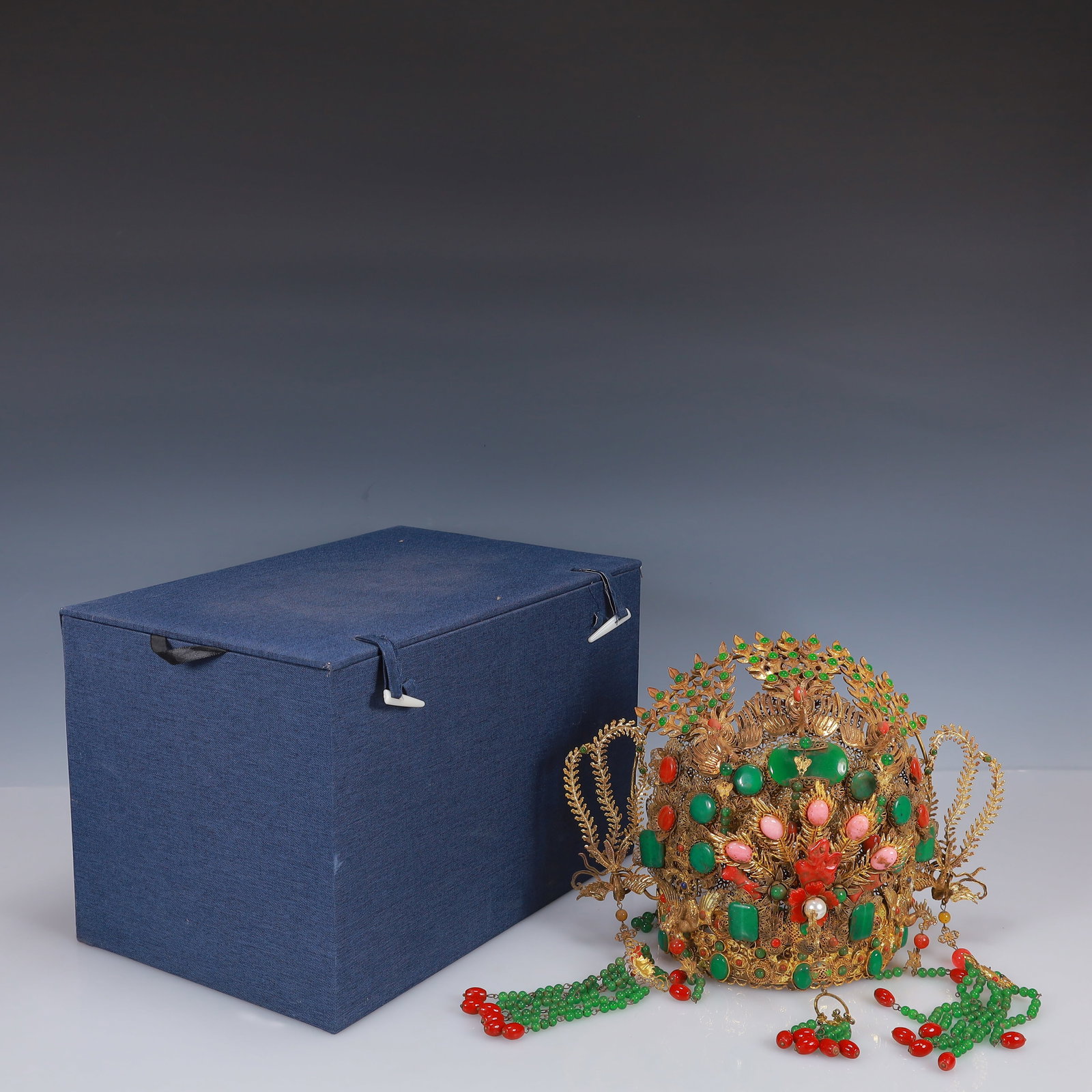 An Exquisite Filigree and Gilding Inlaid Jadeite Phoenix Coronet,Inlaid Gems: An Exquisite Filigree and Gilding Inlaid Jadeite Phoenix Coronet,Inlaid Gems,Qing Dynasty, China,Size:12.2inx7.9inx8.7in,(Box)9.1inx13.8inx9.1in,Weight:1150g 花丝鎏金嵌&#