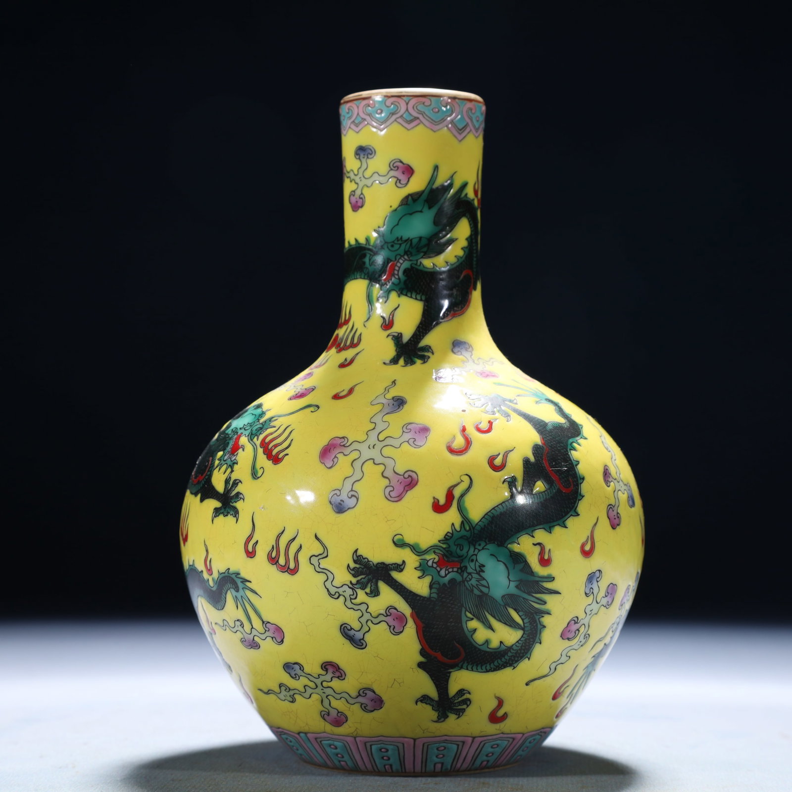 An Exquisite Yellow Ground Famille-Rose Auspicious Cloud and Dragon Pattern Vase: An Exquisite Yellow Ground Famille-Rose Auspicious Cloud and Dragon Pattern Vase,Qing Dynasty,China,Qianlong Six-character Mark,Size:4.3inx6.7in,Weight:1050g 黄地粉彩祥&#