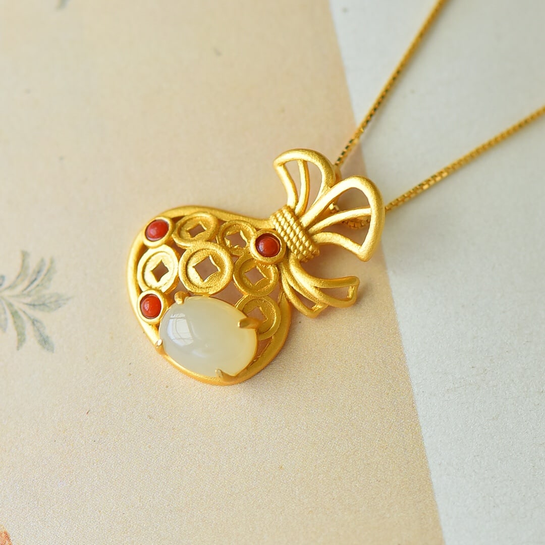 An Exquisite Sterling Silver-Gold Plated Inlaid White Jade Pendant: An Exquisite Sterling Silver-Gold Plated Inlaid White Jade Pendant,Size:0.3inx0.4in 纯银镀金镶白玉吊坠