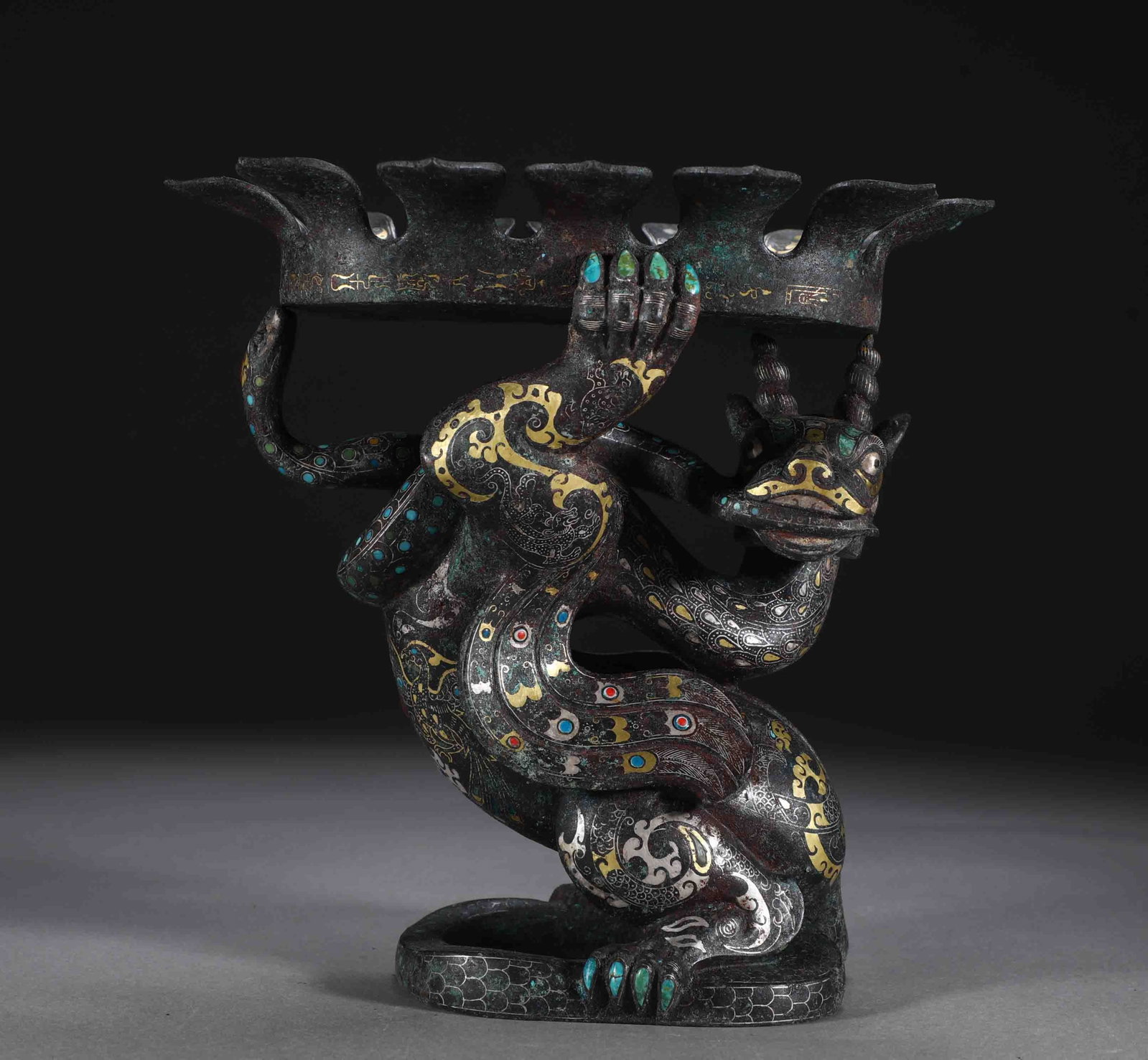 An Exquisite Bronze Inlaid Gold and Silver Dragon Ornament,Inlaid Gems: An Exquisite Bronze Inlaid Gold and Silver Dragon Ornament,Inlaid Gems,the Warring States period in China,Size:8.7inx8.7in,Weight:3950g 铜错金银龙摆件,嵌