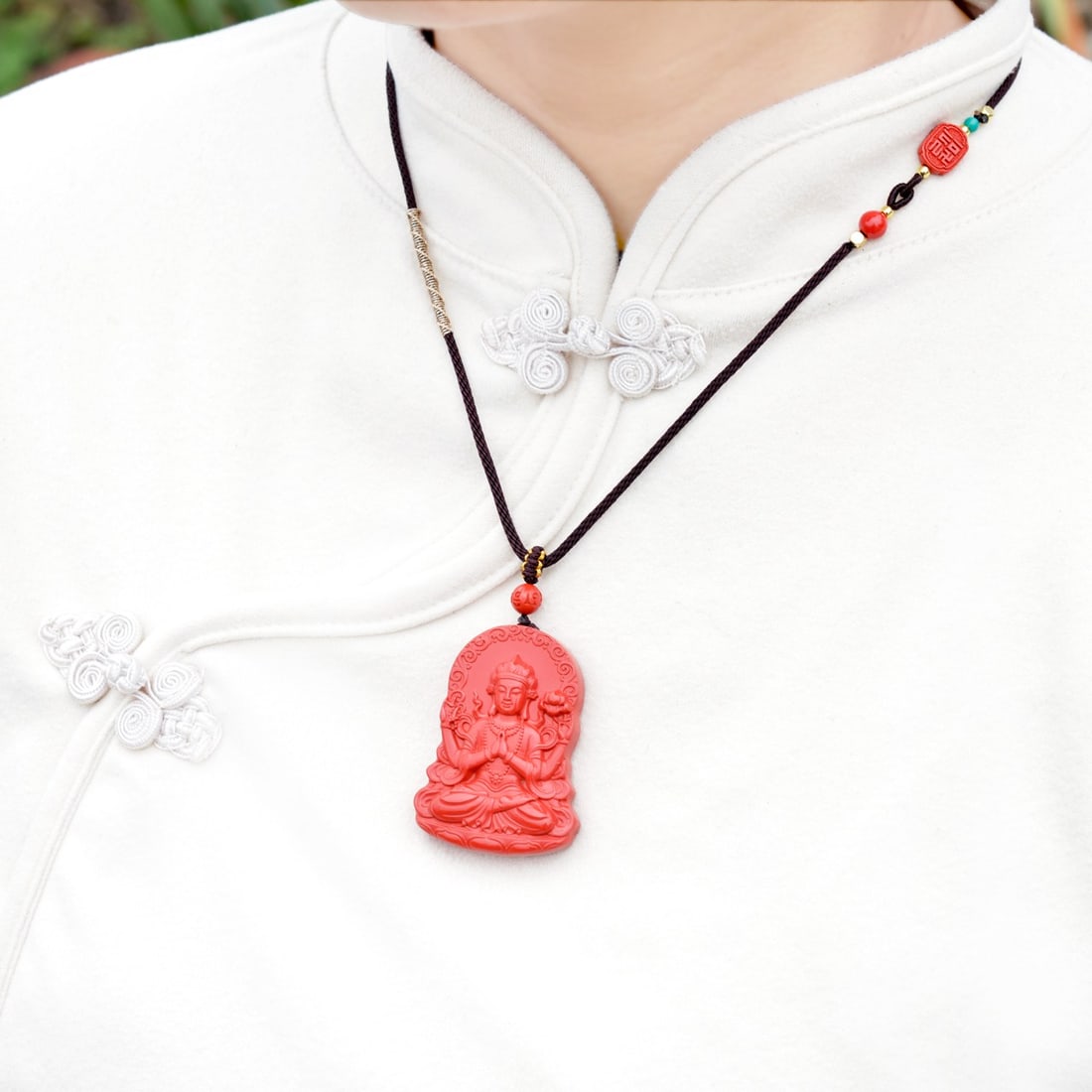 An Exquisite Cinnabar Pendant with Statue of Four-Armed Avalokitesvara: An Exquisite Cinnabar Pendant with Statue of Four-Armed Avalokitesvara,Size:1.4inx1.9in,Weight:33.5g 朱砂挂件带四臂观音像