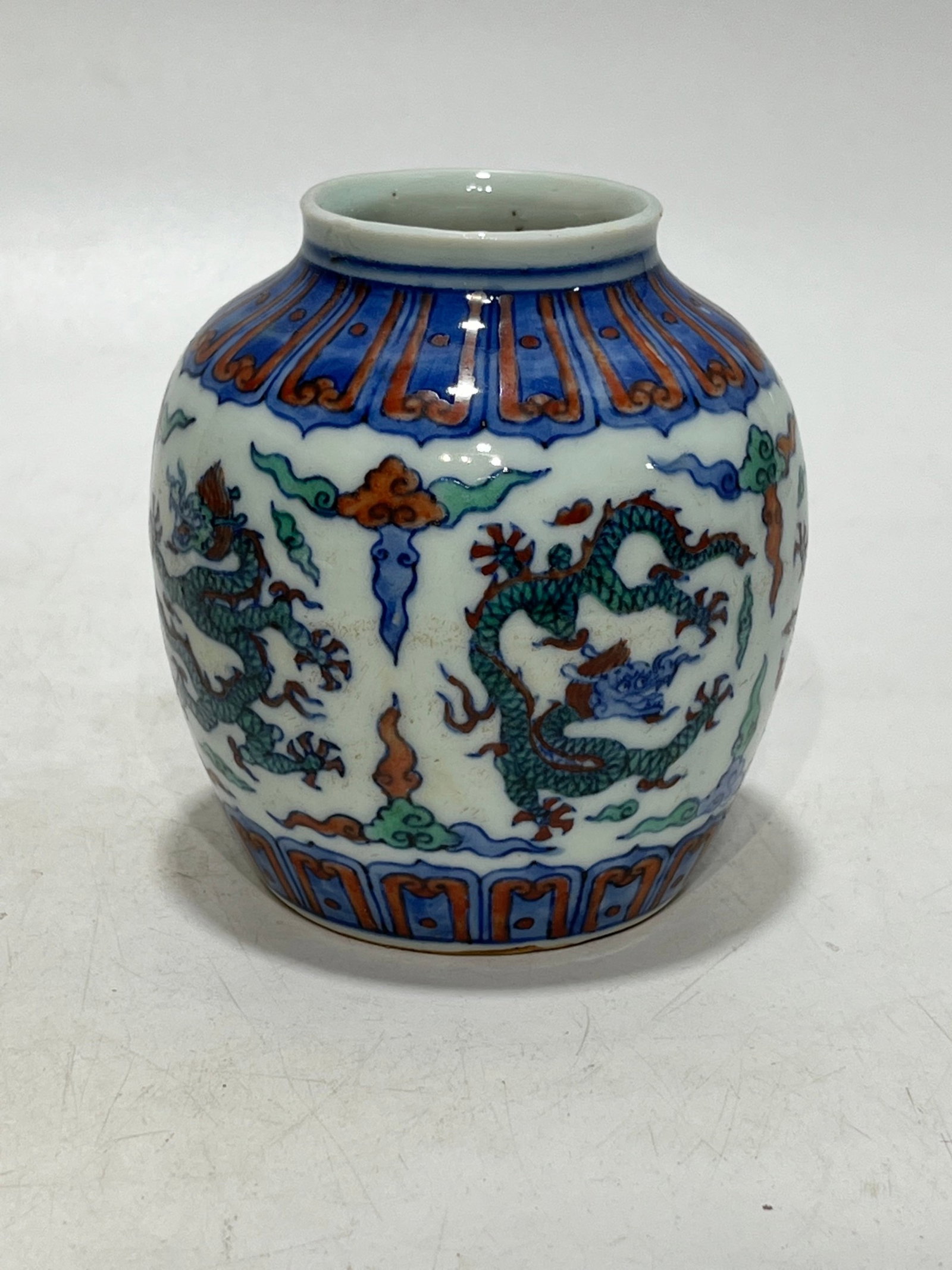 An Exquisite Blue and White Wucai Auspicious Cloud and Dragon Pattern Jar: An Exquisite Blue and White Wucai Auspicious Cloud and Dragon Pattern Jar,Ming Dynasty,China,Wanli Six-character Mark,Size:3.5in 青花五彩祥云龙纹罐
