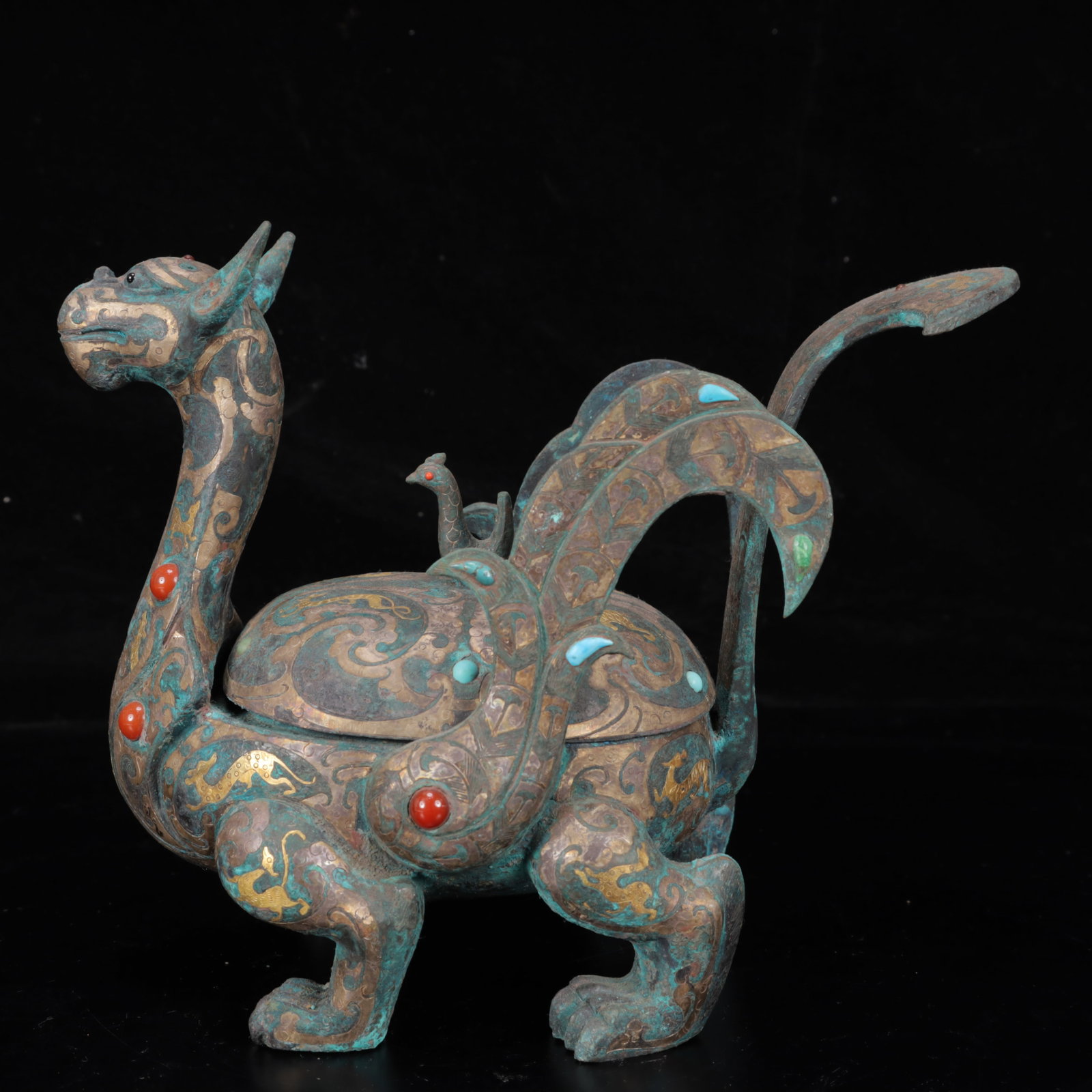 An Archaic Bronze Inlaid Gold and Silver Auspicious Beast Censer,Inlaid Gems: An Archaic Bronze Inlaid Gold and Silver Auspicious Beast Censer,Inlaid Gems,The Warring States period in China,Size:9.4inx4.3inx8.3in,Weight:3050g