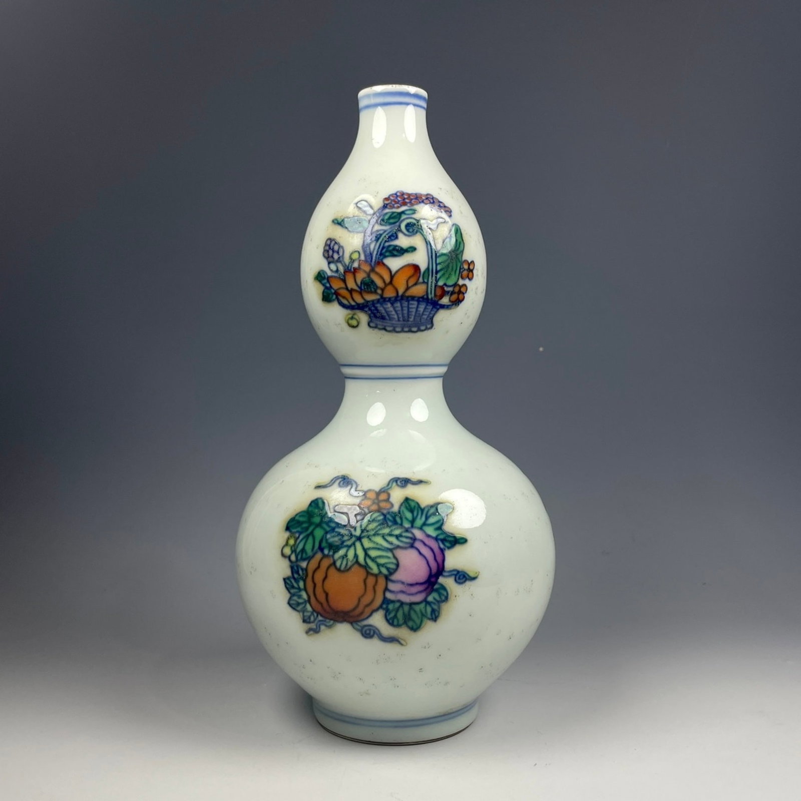 An Exquisite Doucai Melon and Fruit Pattern Gourd-Shaped Vase: An Exquisite Doucai Melon and Fruit Pattern Gourd-Shaped Vase,Qing Dynasty,China,Yongzheng Six-character Mark,Size:7.9inx3.9in 斗彩瓜果纹葫芦瓶,中