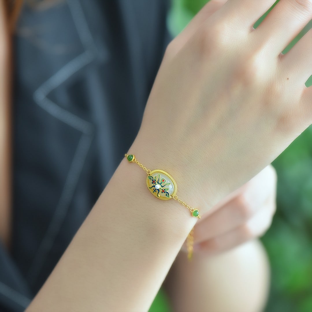 An Exquisite Sterling Silver-Gold Plated Inlaid White Jade Bracelet: An Exquisite Sterling Silver-Gold Plated Inlaid White Jade Bracelet,Size:0.6inx0.4in 纯银镀金镶白玉手链