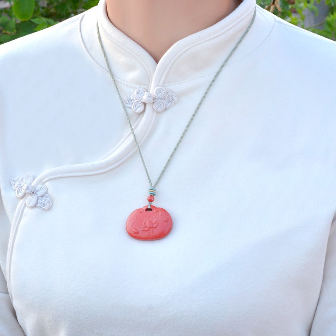 An Exquisite Cinnabar Lotus and Fish Pattern Pendant: An Exquisite Cinnabar Lotus and Fish Pattern Pendant,Size:1.2inx1.5in,Weight:27.5g 朱砂荷花鱼纹挂件