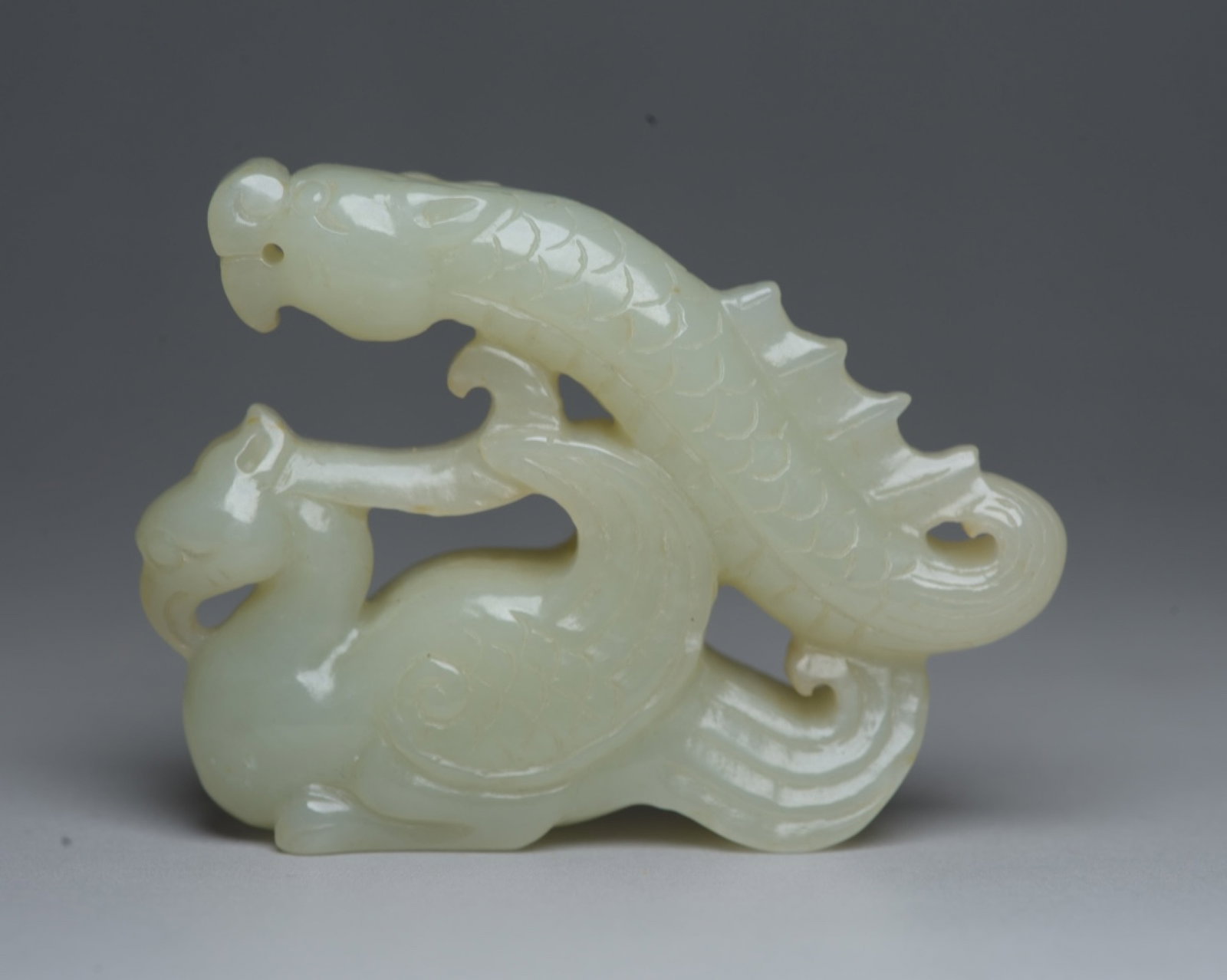 An Exquisite White Jade Dragon and Phoenix Ornament: An Exquisite White Jade Dragon and Phoenix Ornament,Qing Dynasty,China,Size:2.6inx2inx0.7in,Weight:66g 白玉龙凤摆件,中国清代