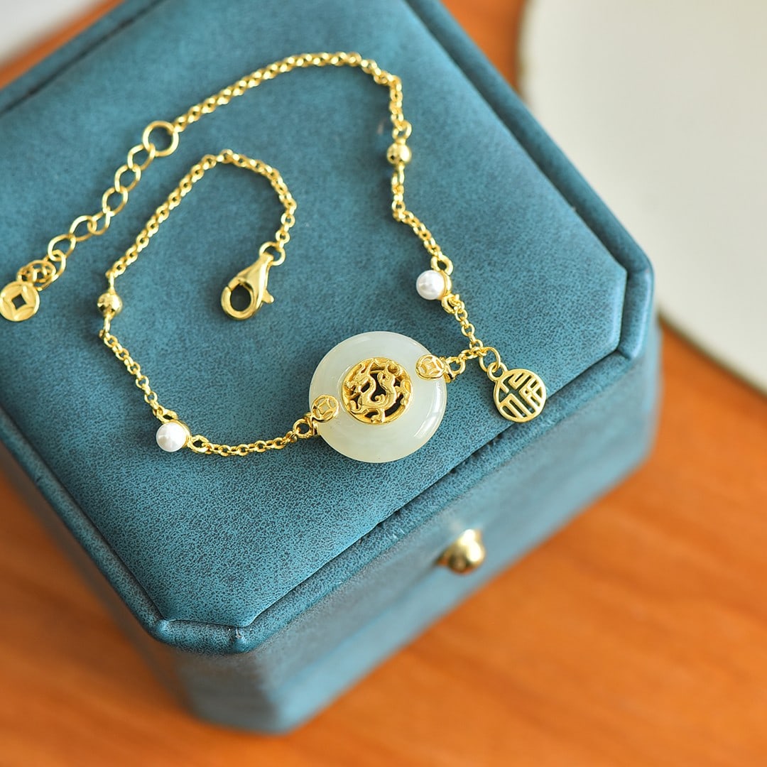 An Exquisite Sterling Silver-Gold Plated Inlaid White Jade Bracelet: An Exquisite Sterling Silver-Gold Plated Inlaid White Jade Bracelet,Size: 0.6inx0.6in 纯银镀金镶白玉手链