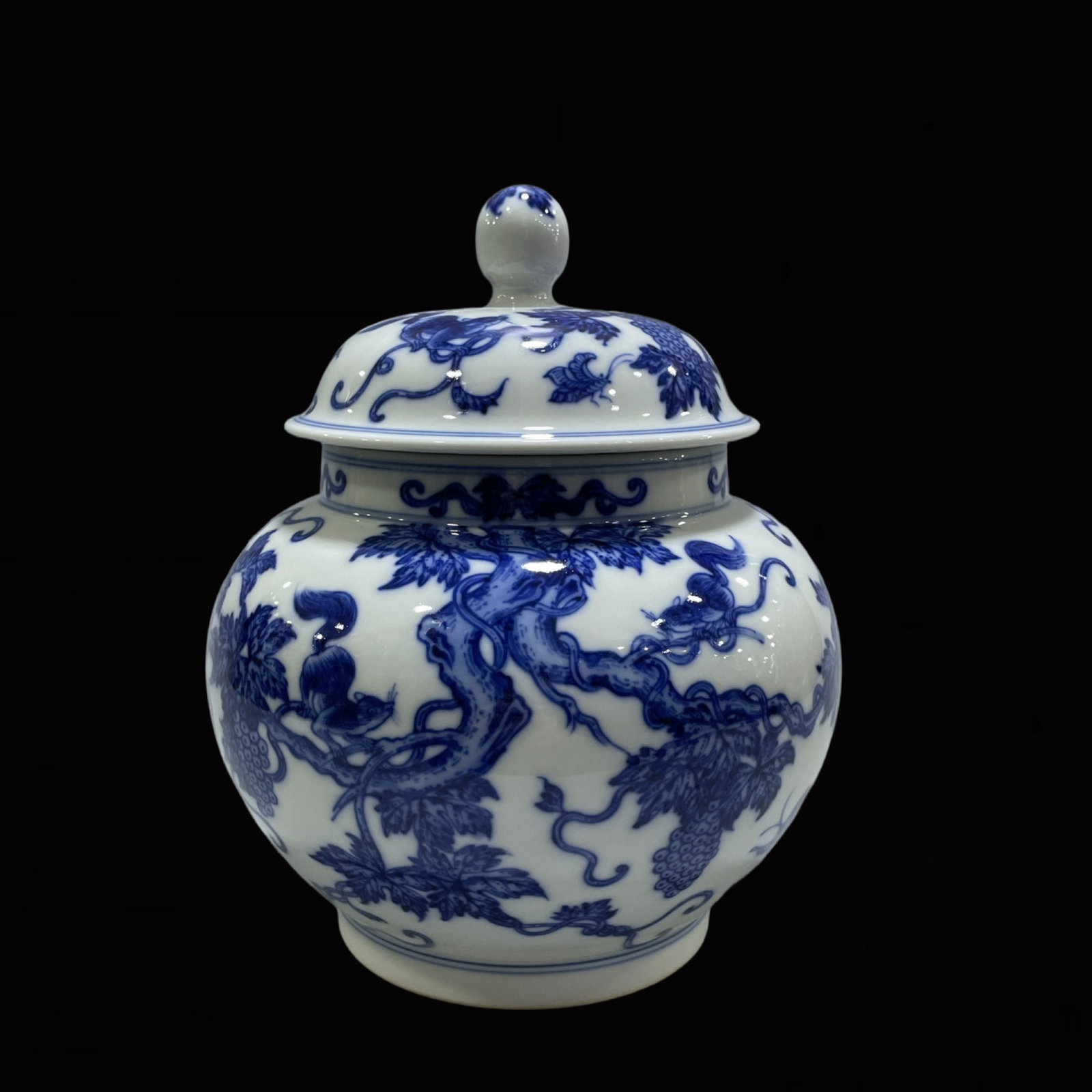 An Exquisite Blue and White Squirrel and Grapes Pattern Jar with Cover: An Exquisite Blue and White Squirrel and Grapes Pattern Jar with Cover,Qing Dynasty,China,Qianlong Six-character Mark,Size:7.7inx6.1in 青花松鼠葡萄纹盖&