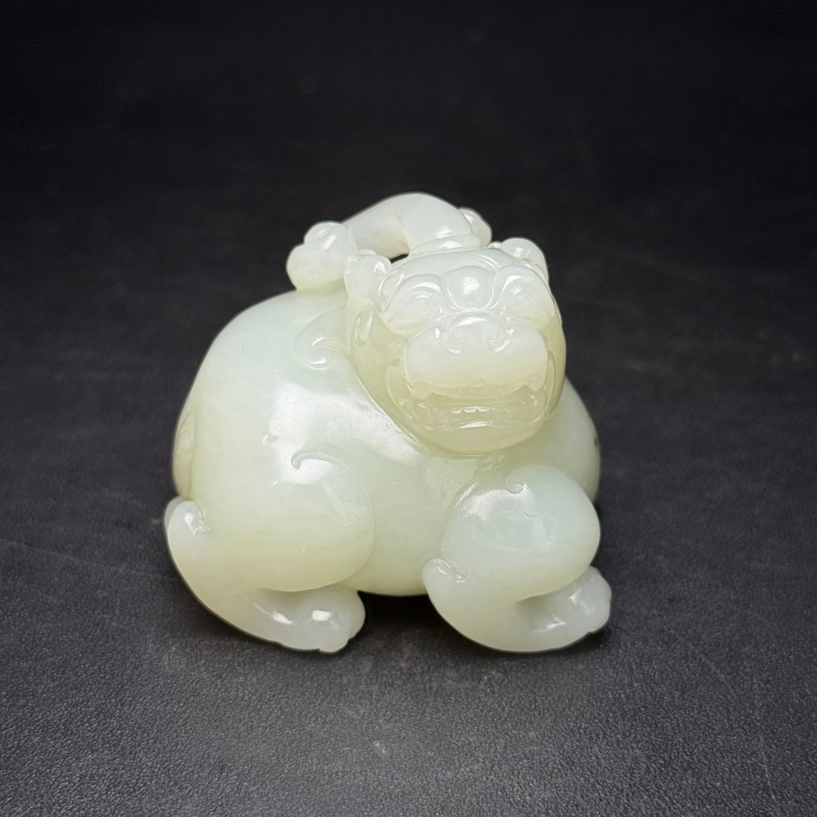 An Exquisite White Jade Wealth-Attracting Creature Ornament: An Exquisite White Jade Wealth-Attracting Creature Ornament,Qing Dynasty,China,Size:1.9inx1.6inx1.6in,Weight:116g 白玉貔貅摆件,中国清代