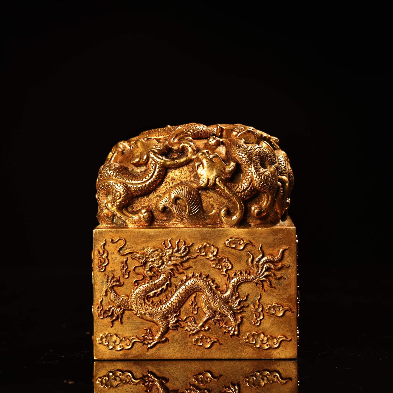An Exquisite Gilt Bronze Auspicious Cloud and Dragon Pattern Seal: An Exquisite Gilt Bronze Auspicious Cloud and Dragon Pattern Seal,Qing Dynasty,China,Size:3.5inx3.1in,Weight:3100g 铜鎏金祥云龙纹印章,中