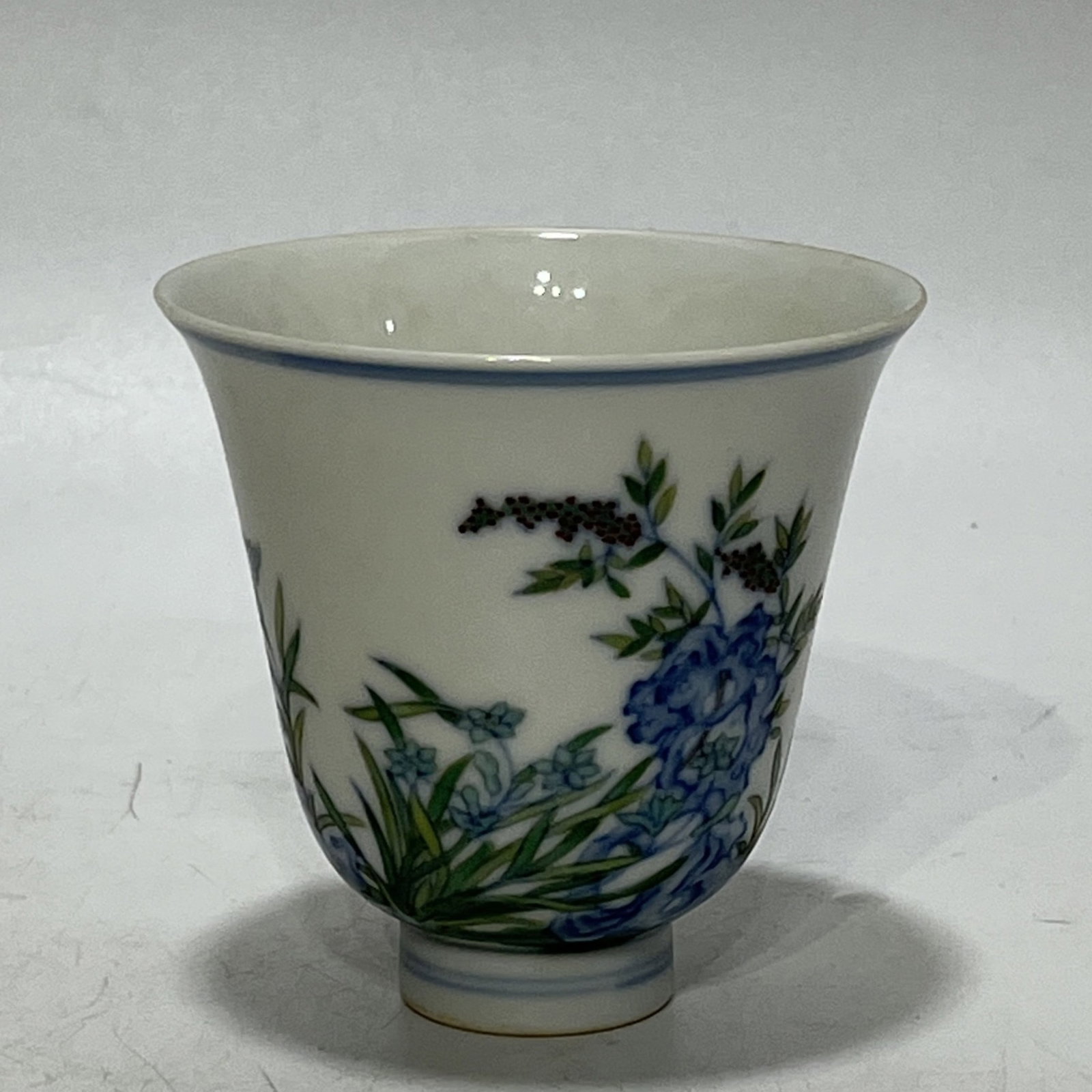 An Exquisite Blue and White Doucai Flower Pattern Cup: An Exquisite Blue and White Doucai Flower Pattern Cup,Qing Dynasty,China,Yongzheng Six-character Mark,Size:3.2in
