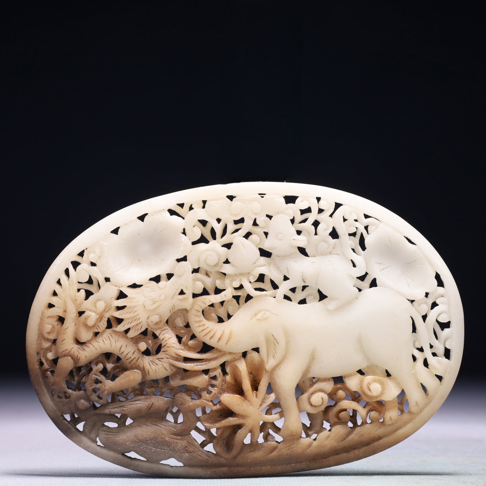 An Exquisite White Jade Flower and Dragon Pattern Pendant: An Exquisite White Jade Flower and Dragon Pattern Pendant,Qing Dynasty,China,Size:5.5inx3.7in,Weight:142.6g 白玉花卉龙纹佩,中国清代