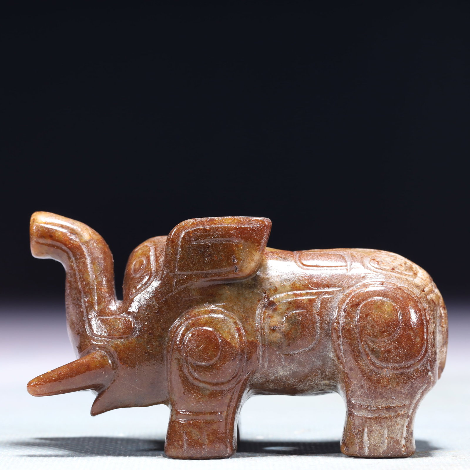 An Exquisite Archaic Jade Elephant Ornament: An Exquisite Archaic Jade Elephant Ornament,Ancient Time,China,Size:3.1inx1.2inx1.8in,Weight:194.1g 高古玉象摆件,中国远古时期