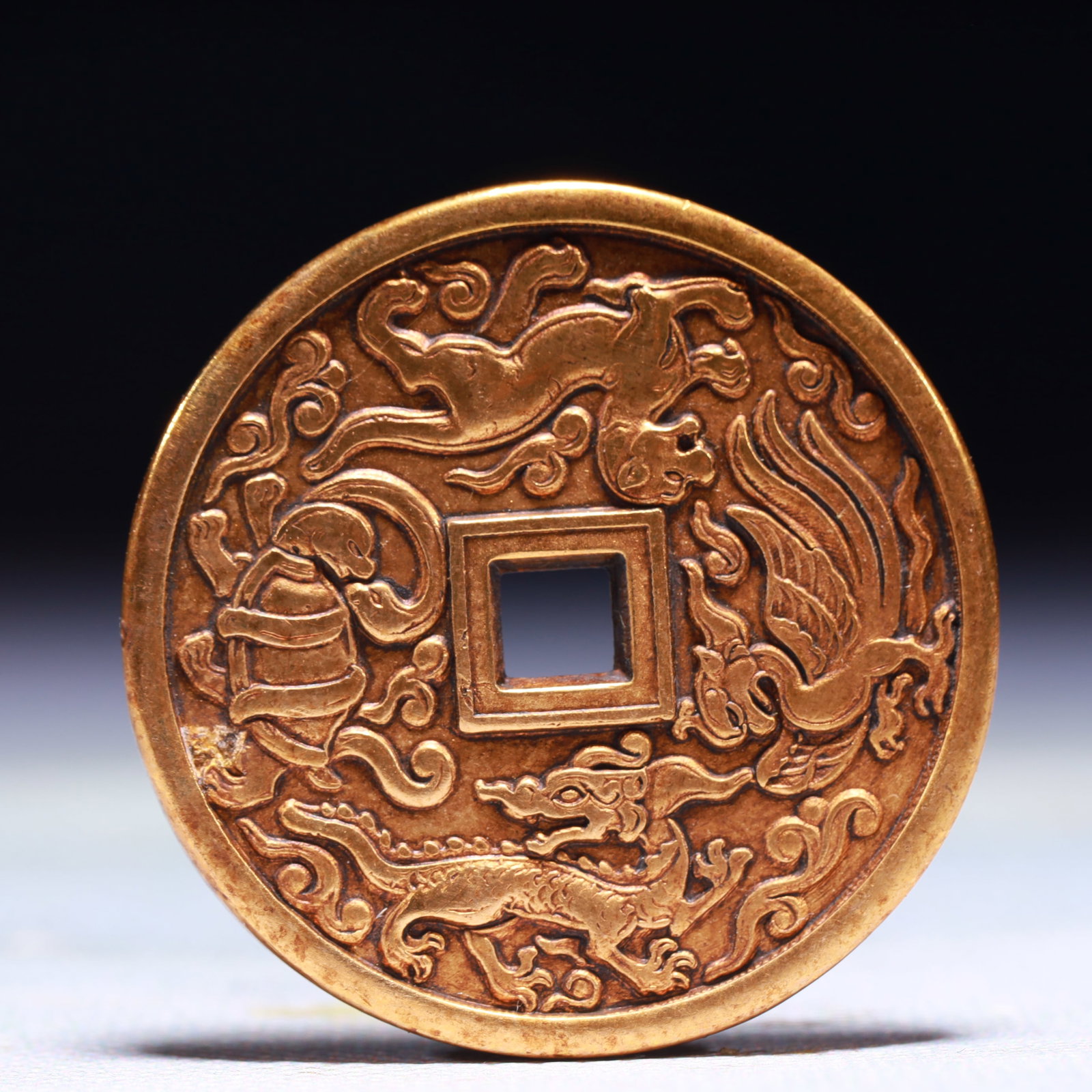 An Exquisite Gilt Bronze Auspicious Beast Pattern Cash Coin: An Exquisite Gilt Bronze Auspicious Beast Pattern Cash Coin,Han Dynasty,China,Size:1.6in,Weight:32g 铜鎏金瑞兽纹钱币,中国汉代