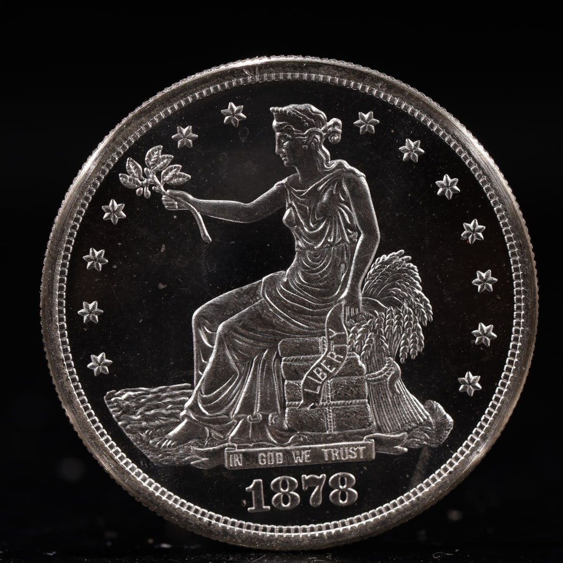 USA Trade Dollar 1878 Coin: American coin. Obverse: Liberty seated on a pedestal facing the sea to the left holding olive branches surrounded by 13 stars. IN GOD WE TRUST / LIBERTY / 1878. Reverse: An eagle holding branches with