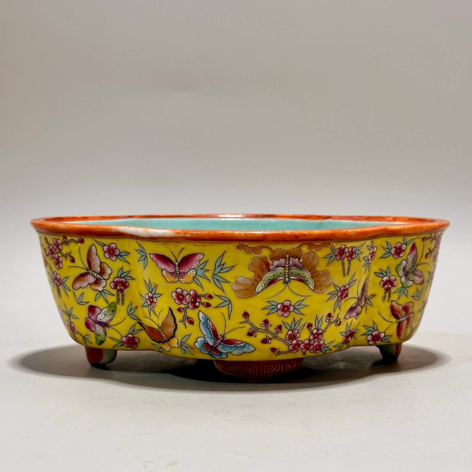 An Exquisite Yellow Ground Famille-Rose Flower and Butterfly Pattern Brush Washer: An Exquisite Yellow Ground Famille-Rose Flower and Butterfly Pattern Brush Washer,Qing Dynasty,China,Qianlong Six-character Mark,Size:2.3inx6.7in 黄地粉彩花卉උ