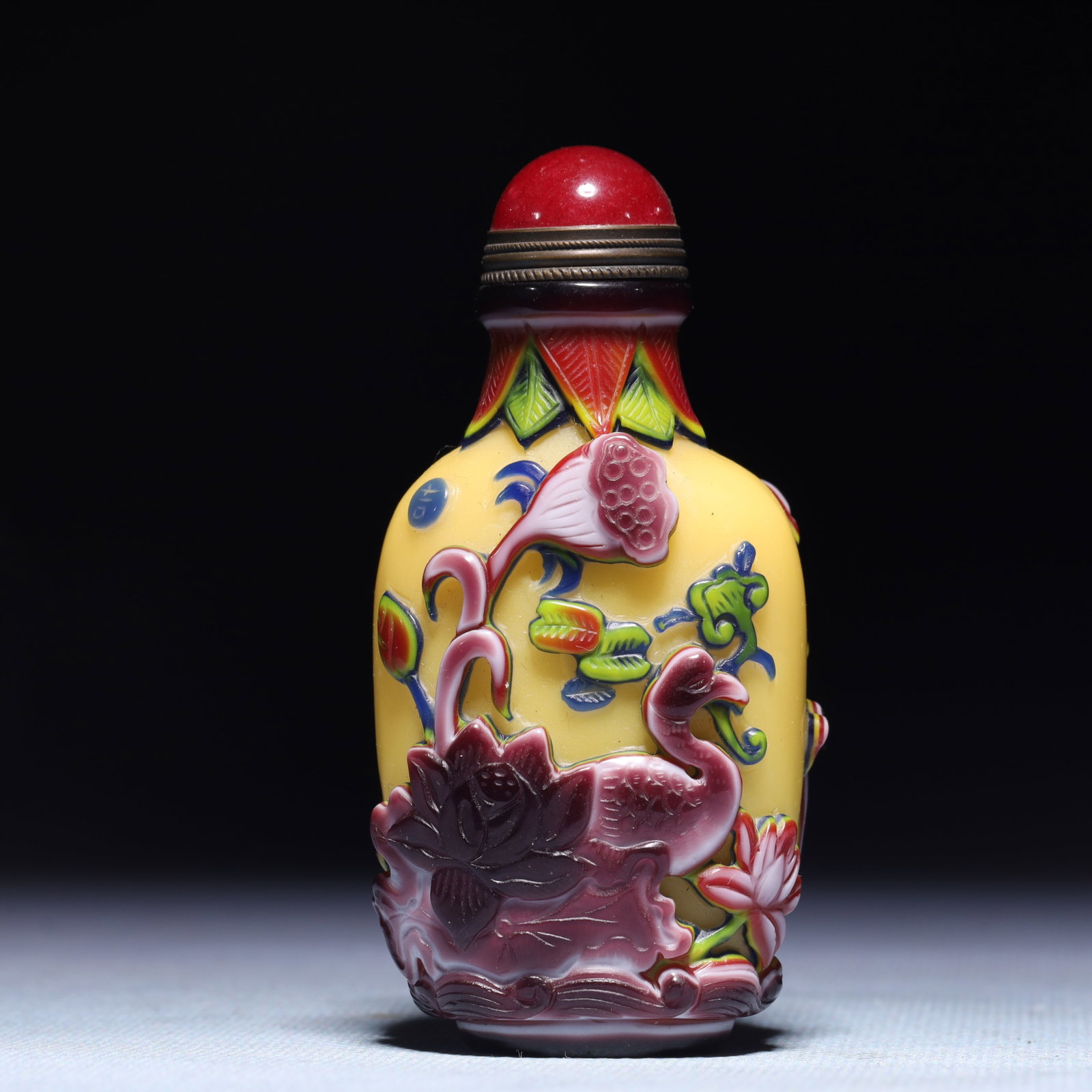 An Exquisite Glass Lotus Fish Pattern Snuff Bottle: An Exquisite Glass Lotus Fish Pattern Snuff Bottle,Qing Dynasty,China,Qianlong Four-character Mark,Size:1.8inx1inx3.1in,Weight:76.9g 琉璃莲花鱼纹鼻烟
