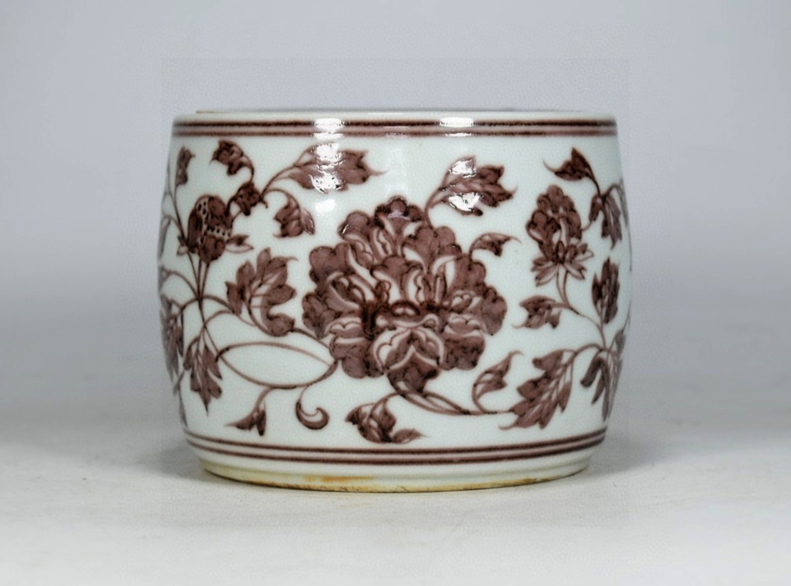An Exquisite Underglaze-Red Lotus Pattern Jar with Cover: An Exquisite Underglaze-Red Lotus Pattern Jar with Cover,Ming Dynasty,China,Xuande Six-character Mark,Size:5.1inx5.9in 釉里红缠枝莲纹盖罐,中