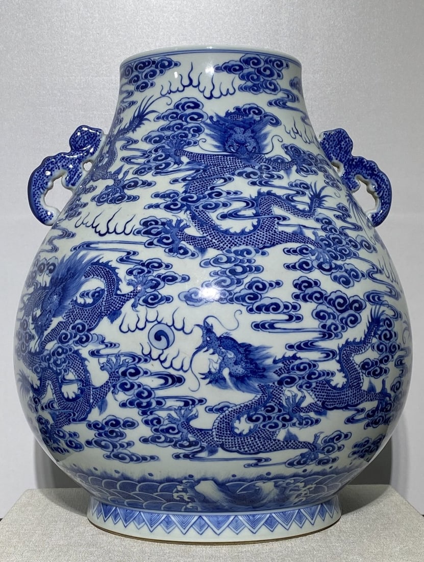 A Rare Blue and White Auspicious Cloud and Dragon Pattern Double-Ears Vase: A Rare Blue and White Auspicious Cloud and Dragon Pattern Double-Ears Vase,Qing Dynasty,China,Qianlong Six-character Mark,Size:15inx13.8in 青花祥云龙纹双ň