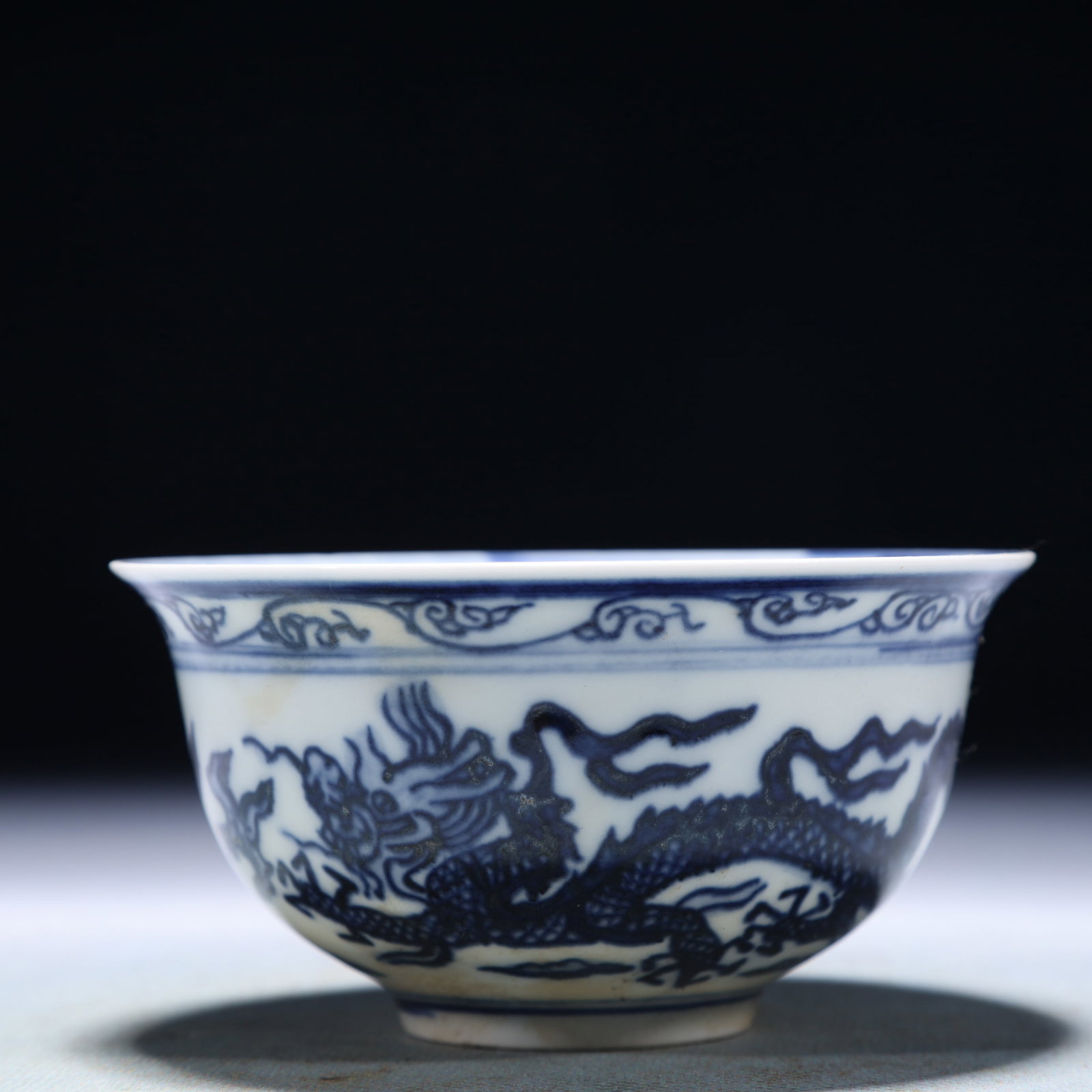 An Exquisite Blue and White Auspicious Cloud and Dragon Pattern Bowl: An Exquisite Blue and White Auspicious Cloud and Dragon Pattern Bowl,Qing Dynasty,China,Size:3.8inx2in,Weight:100g 青花祥云龙纹碗,中国清