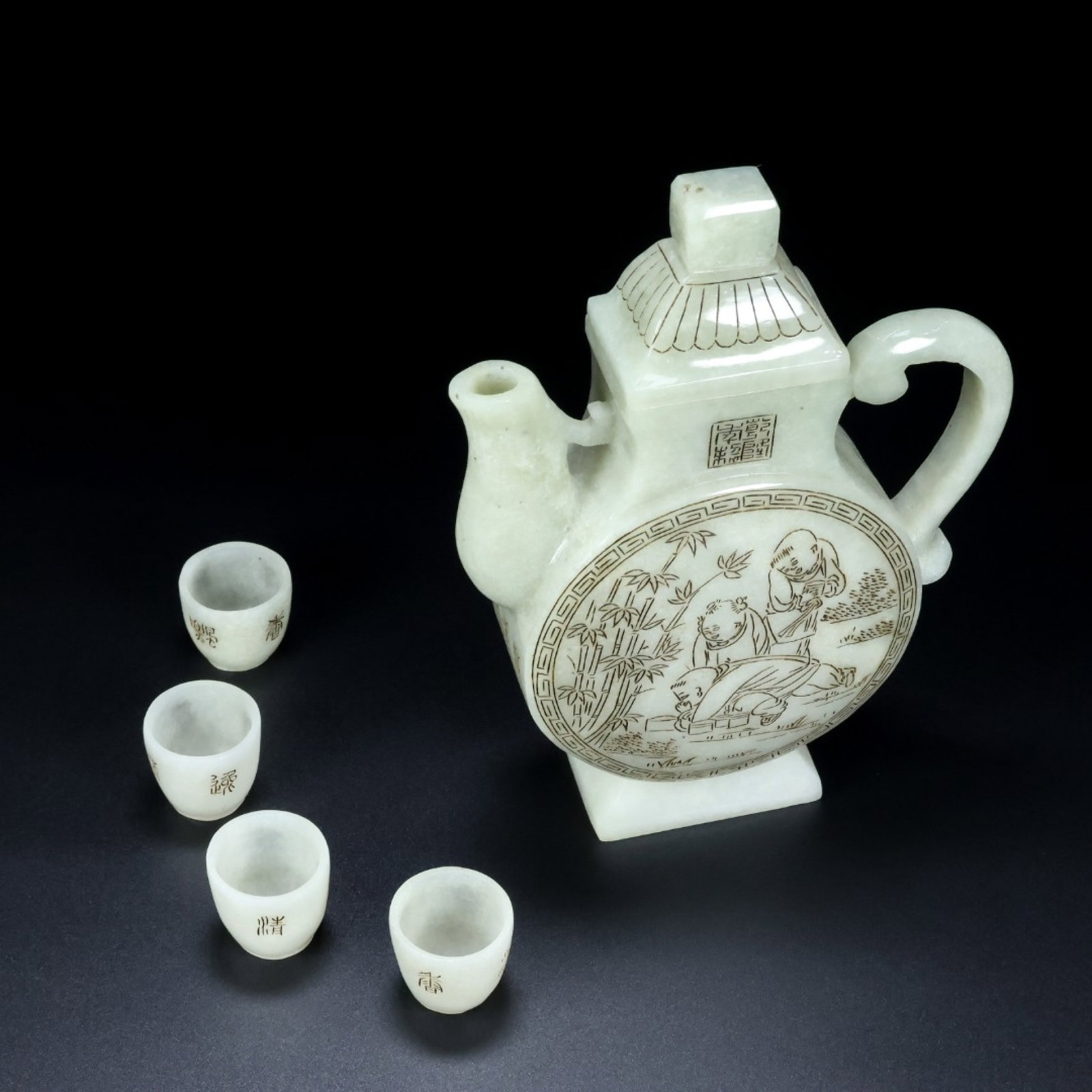 An Exquisite White Jade Figure and Story Pattern Ewer,with Four Cups: An Exquisite White Jade Figure and Story Pattern Ewer,with Four Cups,Qing Dynasty,China,Qianlong Four-Character Mark,Size:(壶)7.1inx5.5inx1.7in,(杯)1.2inx1.1in,Weight:721.5g 白஍