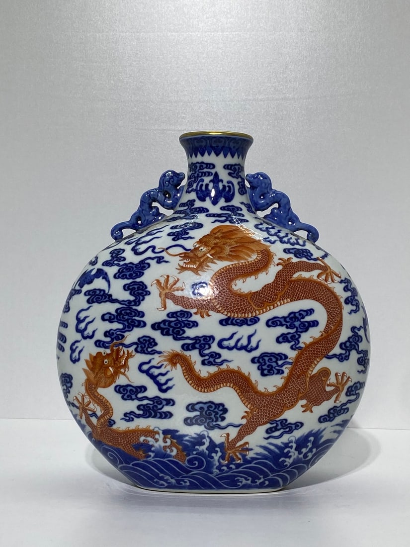 An Exquisite Blue and White Iron-Red Painted Gold Auspicious Cloud and Dragon Pattern Dragon-Ears: An Exquisite Blue and White Iron-Red Painted Gold Auspicious Cloud and Dragon Pattern Dragon-Ears Vase,Qing Dynasty,China,Qianlong Six-character Mark,Size:11.4inx9.8in 青花矾红