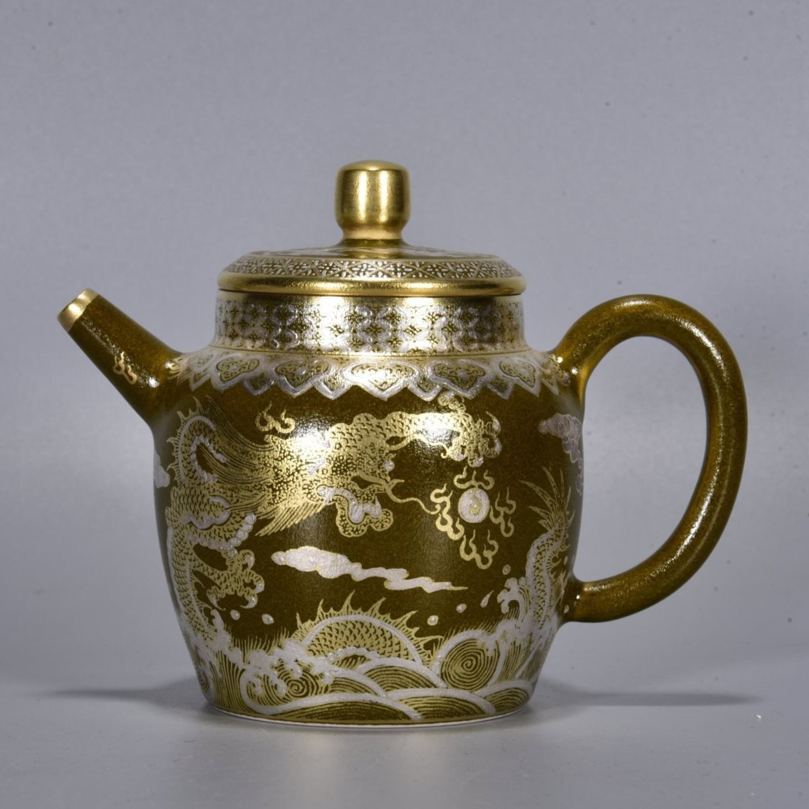 An Exquisite Teadust Glazed Painted Gold Painted Silver Seawater and Dragon Pattern Teapot: An Exquisite Teadust Glazed Painted Gold Painted Silver Seawater and Dragon Pattern Teapot,Qing Dynasty,China,Yongzheng Four-character Mark,Size:3.9inx5.1in 茶叶末釉描