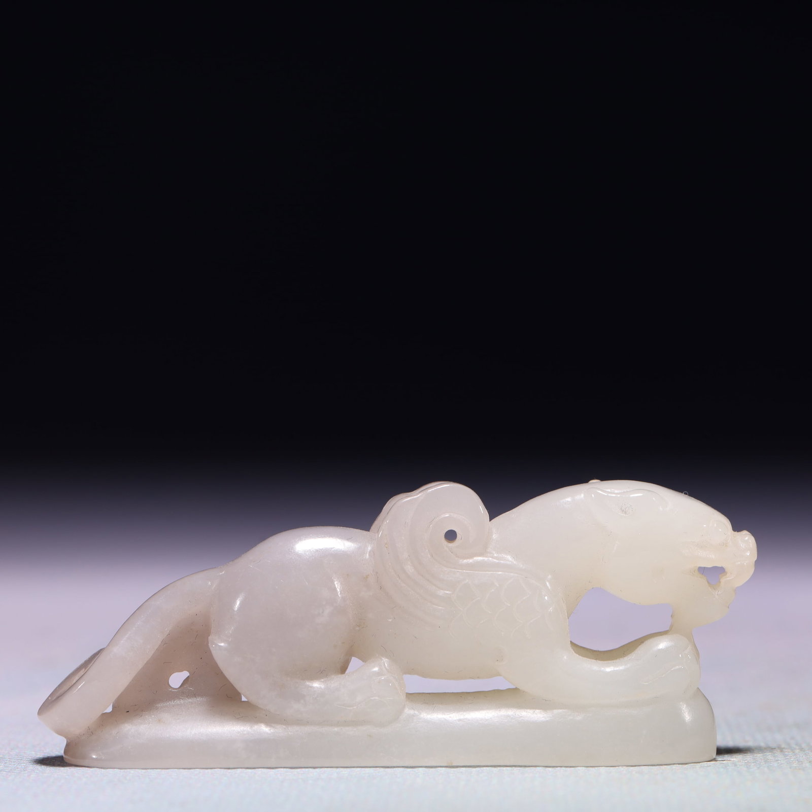 An Exquisite White Jade Beast Ornament: An Exquisite White Jade Beast Ornament,Qing Dynasty,China,Size:2.8inx0.4inx1.1in,Weight:45.9g 白玉兽摆件,中国清代
