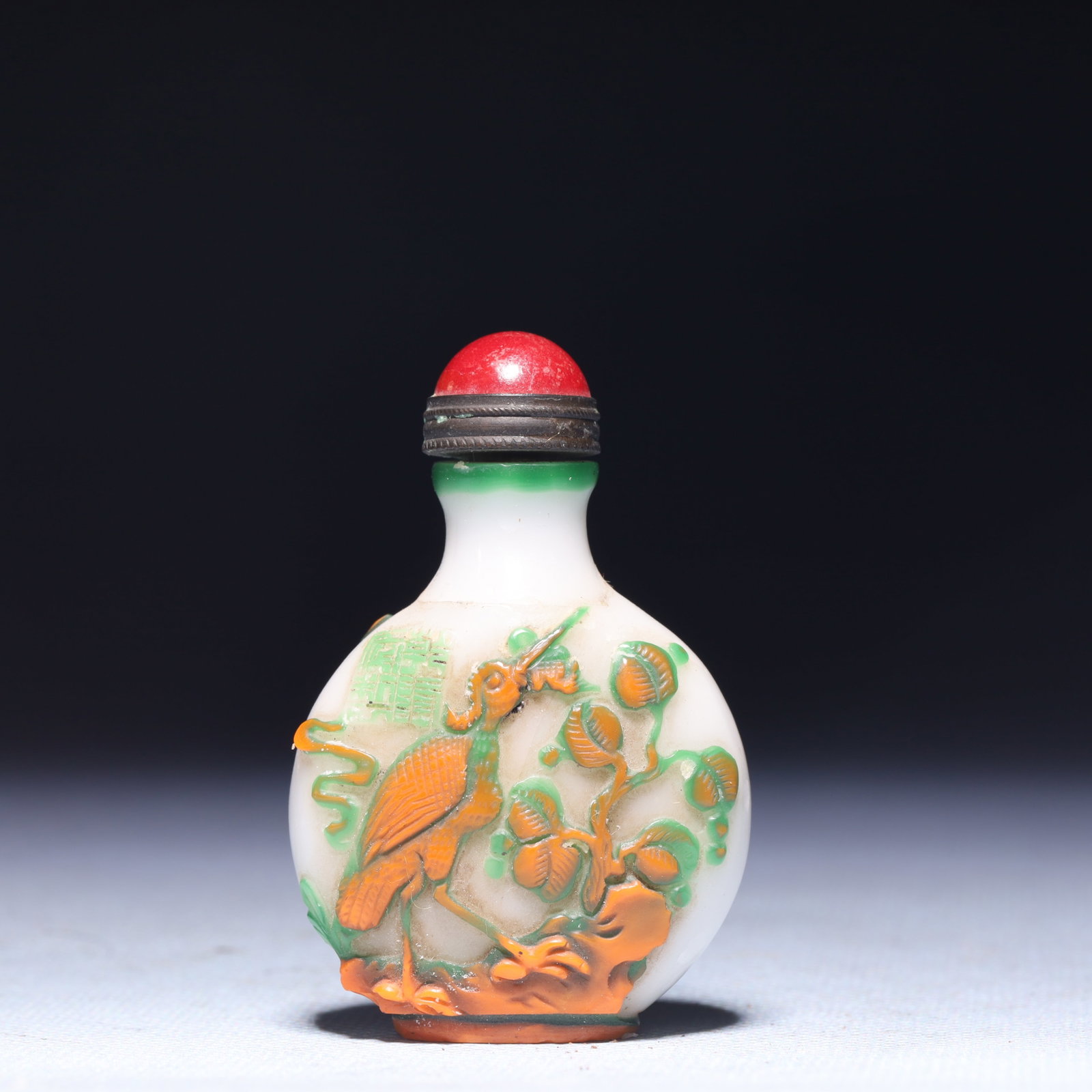 An Exquisite Glass Flower and Bird Pattern Snuff Bottle: An Exquisite Glass Flower and Bird Pattern Snuff Bottle,Qing Dynasty,China,Size:1.6inx0.8inx2.4in,Weight:45.1g 琉璃花鸟纹鼻烟壶,中国清