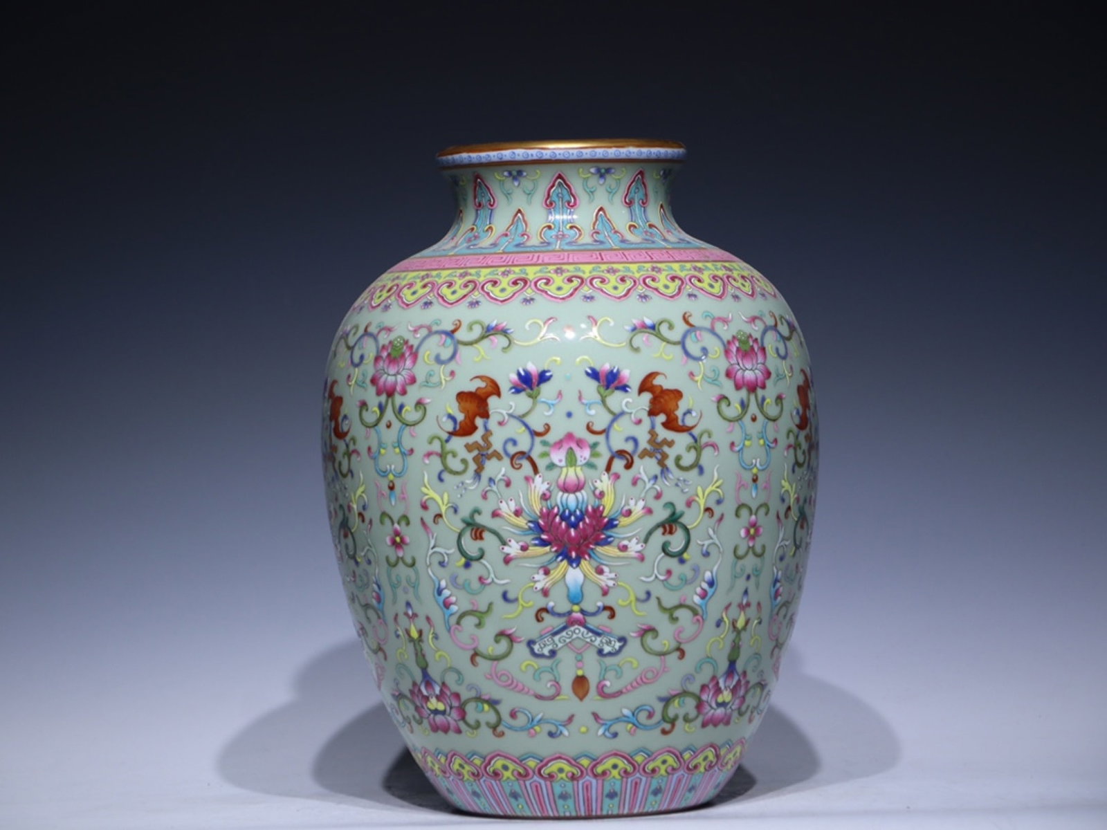 An Exquisite Celadon Glazed Famille-Rose Painted Gold Lotus Pattern Jar: An Exquisite Celadon Glazed Famille-Rose Painted Gold Lotus Pattern Jar,Qing Dynasty,China,Qianlong Six-character Mark,Size:11.6inx8.7inx4.4in 青釉粉彩描金缠&