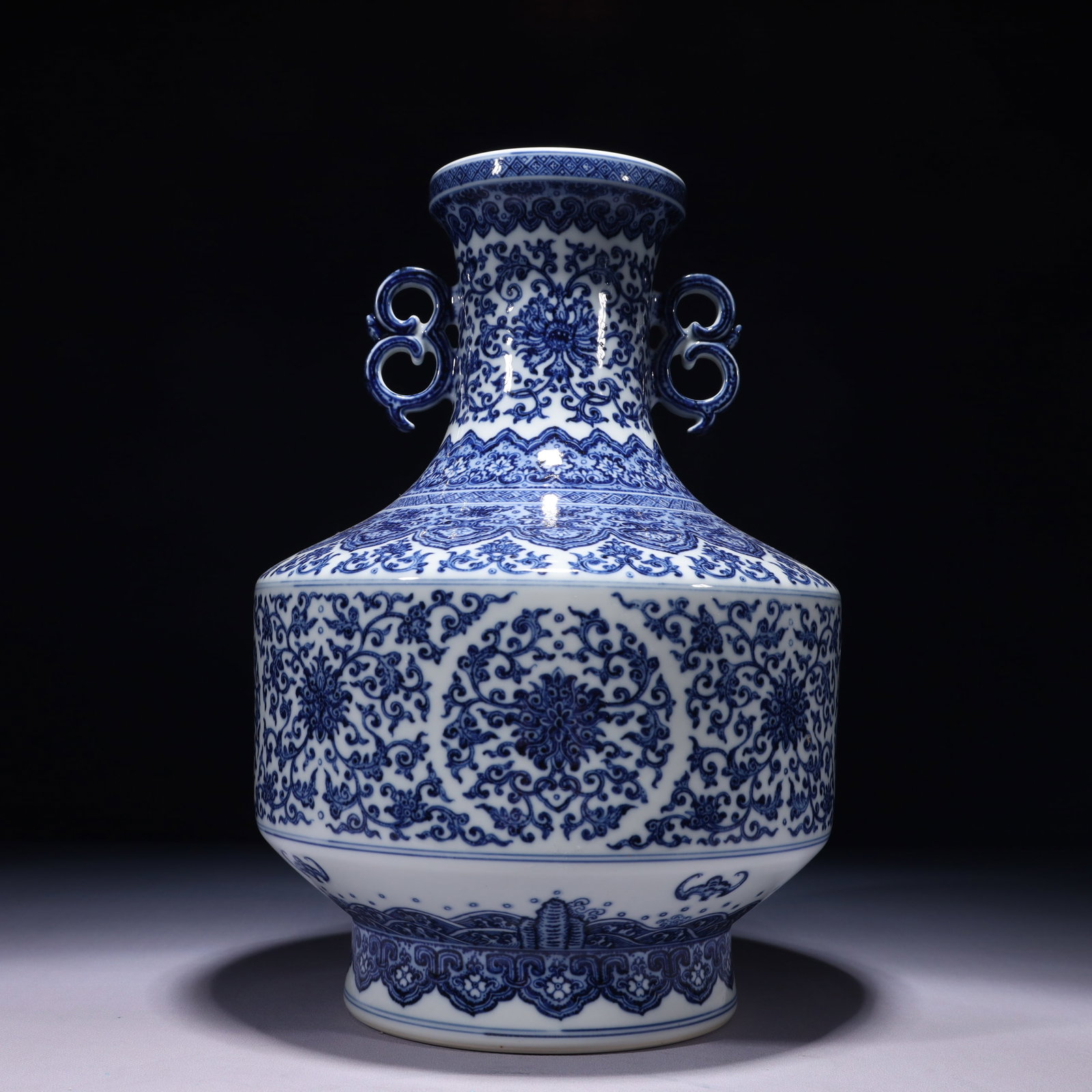 An Exquisite Blue and White Lotus Pattern Double-Ears Vase: An Exquisite Blue and White Lotus Pattern Double-Ears Vase,Qing Dynasty,China,Qianlong Six-character Mark,Size:9.4inx14.6in,Weight:4550g 青花缠枝莲纹双耳
