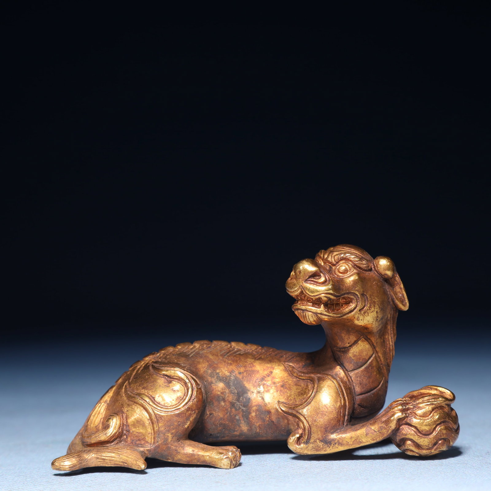 An Exquisite Gilt Bronze Dog Ornament: An Exquisite Gilt Bronze Dog Ornament,Qing Dynasty,China,Size:3.7inx1.4inx1.8in,Weight:350g 铜鎏金犬摆件,中国清代