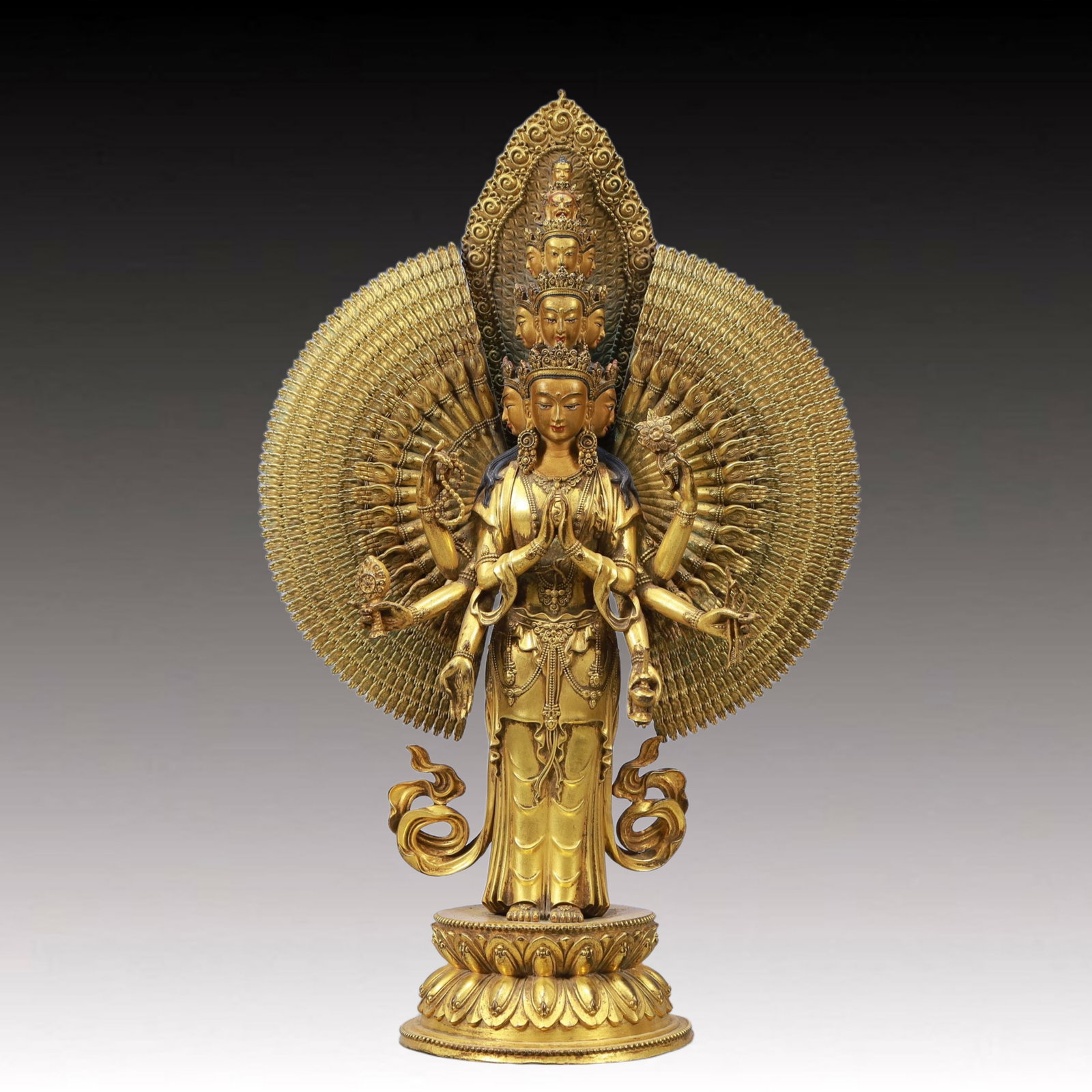A Solemn Gilt Bronze Statue of Thousand-hand Guanyin: A Solemn Gilt Bronze Statue of Thousand-hand Guanyin,Ming Dynasty, China,Size:8.3inx3.9inx13in Weight:3000g 铜鎏金千手观音像,中国明