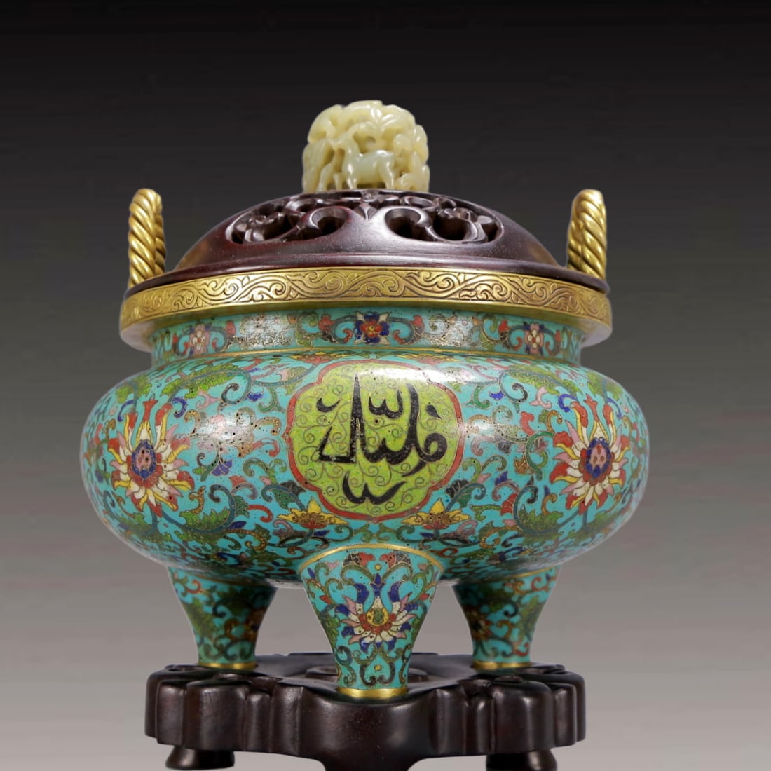 An Archaic Cloisonne Lotus Pattern Double-Ears and Tripod Censer,with Arabic,with Zitanwood Inlaid: An Archaic Cloisonne Lotus Pattern Double-Ears and Tripod Censer,with Arabic,with Zitanwood Inlaid White Jade Cover,Qing Dynasty, China,Qianlong Four-character Mark,Size:6.7inx7.1inx10.2in,Weight:2900