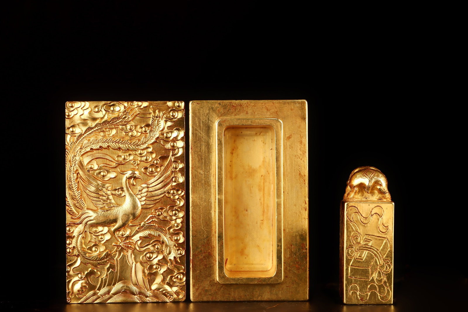 An Exquisite Gilt Bronze Auspicious Cloud and Peacock Pattern Seal: An Exquisite Gilt Bronze Auspicious Cloud and Peacock Pattern Seal,Qing Dynasty, China,Qianlong Four-character Mark,Size:3.9inx2.4inx1.6in Weight:1617g 铜鎏金祥云孔
