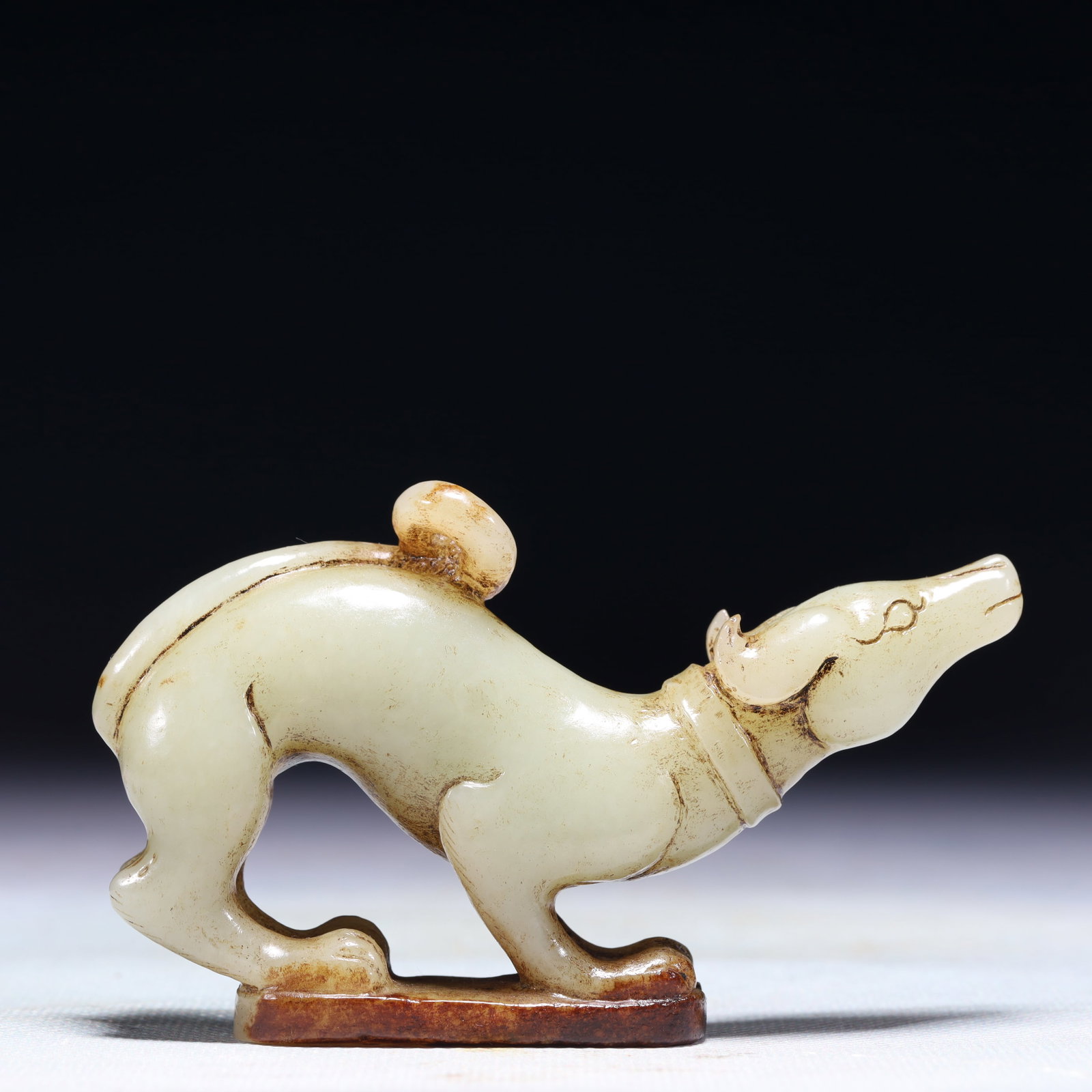 An Exquisite White Jade Dog Ornament: An Exquisite White Jade Dog Ornament,Qing Dynasty,China,Size:3.9inx0.9inx2.4in,Weight:150g 白玉犬摆件,中国清代