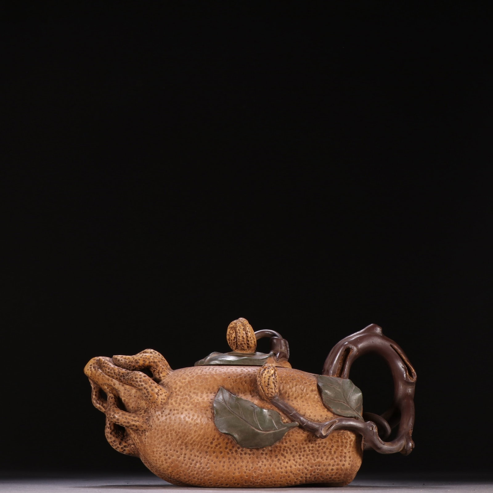 A Rare Purple Sands Bergamot-Shaped Teapot: A Rare Purple Sands Bergamot-Shaped Teapot,Qing Dynasty,China,Jiang Rong Mark,Size:3.5inx7.4in 紫砂佛手形茶壶,中国清代,蒋蓉