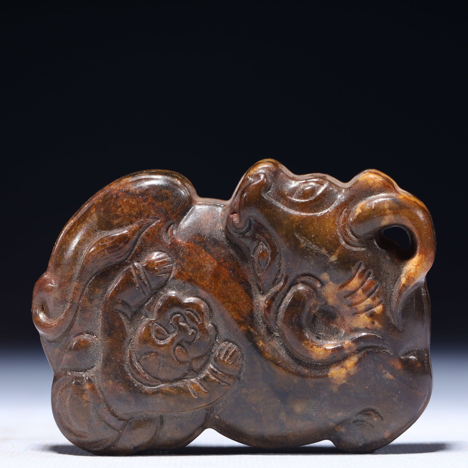 An Exquisite Archaic Jade Buffalo Pattern Pendant: An Exquisite Archaic Jade Buffalo Pattern Pendant,Ancient Time,China,Size:2.2inx0.4inx3in,Weight:131g 高古玉牛纹挂件,中国远古时&