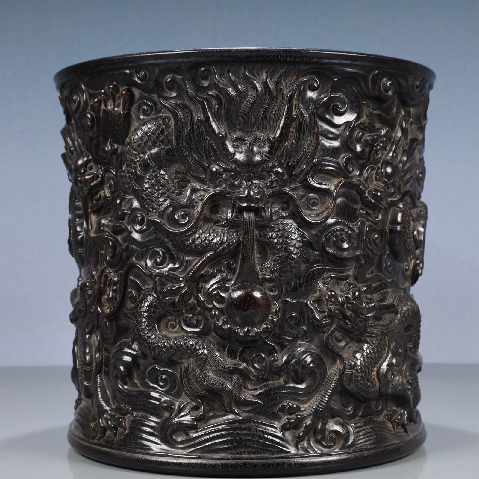 An Exquisite Zitanwood Auspicious Cloud and Dragon Pattern Brush Pot: An Exquisite Zitanwood Auspicious Cloud and Dragon Pattern Brush Pot,Qing Dynasty, China,Size:10.6inx10.2in,Weight:3500g 紫檀木祥云龙纹笔筒,ߑ