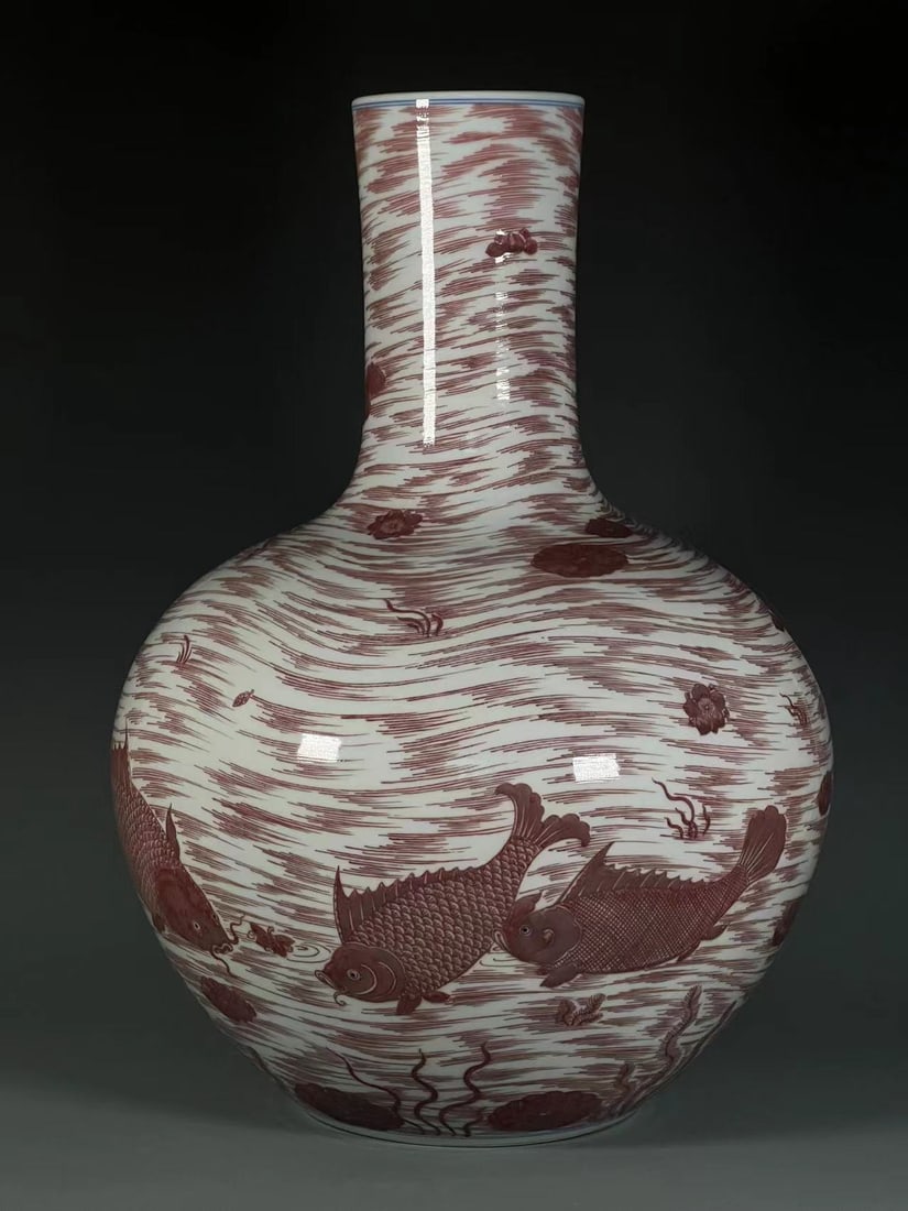 A Huge Underglaze-Red Fish Pattern Vase: A Huge Underglaze-Red Fish Pattern Vase,Qing Dynasty,China,Qianlong Six-character Mark,Size:21.2inx4.7inx7.5in 釉里红鱼纹瓶,中国清代,乾