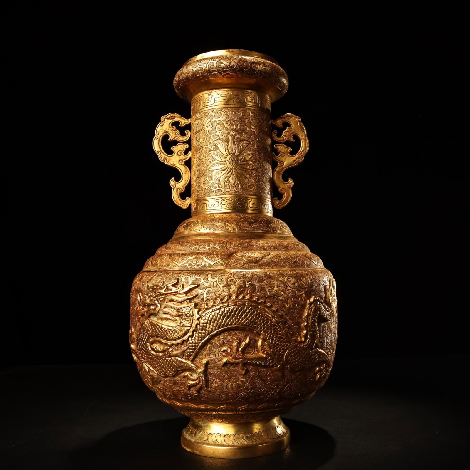 An Exquisite Gilt Bronze Auspicious Cloud and Dragon Pattern Double-Ears Vase: An Exquisite Gilt Bronze Auspicious Cloud and Dragon Pattern Double-Ears Vase,Qing Dynasty,China,Size:13.8inx8.7in,Weight:2410g 铜鎏金祥云龙纹双耳