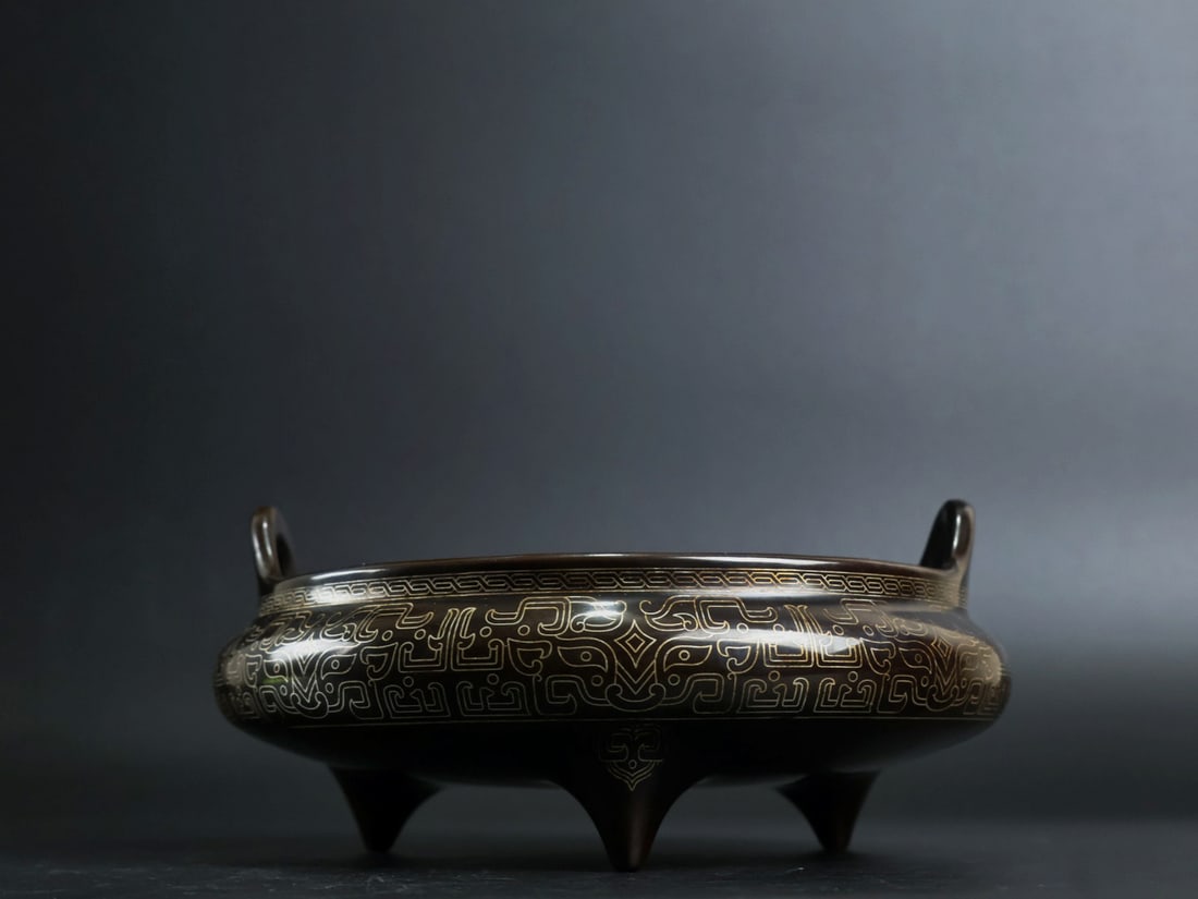 An Exquisite Bronze Inlaid Silver Beast-Face Pattern Double-Ears and Tripod Censer: An Exquisite Bronze Inlaid Silver Beast-Face Pattern Double-Ears and Tripod Censer,Qing Dynasty, China, With Mark,Size:3inx5.9in,Weight:1420g 铜嵌银兽面纹双&#