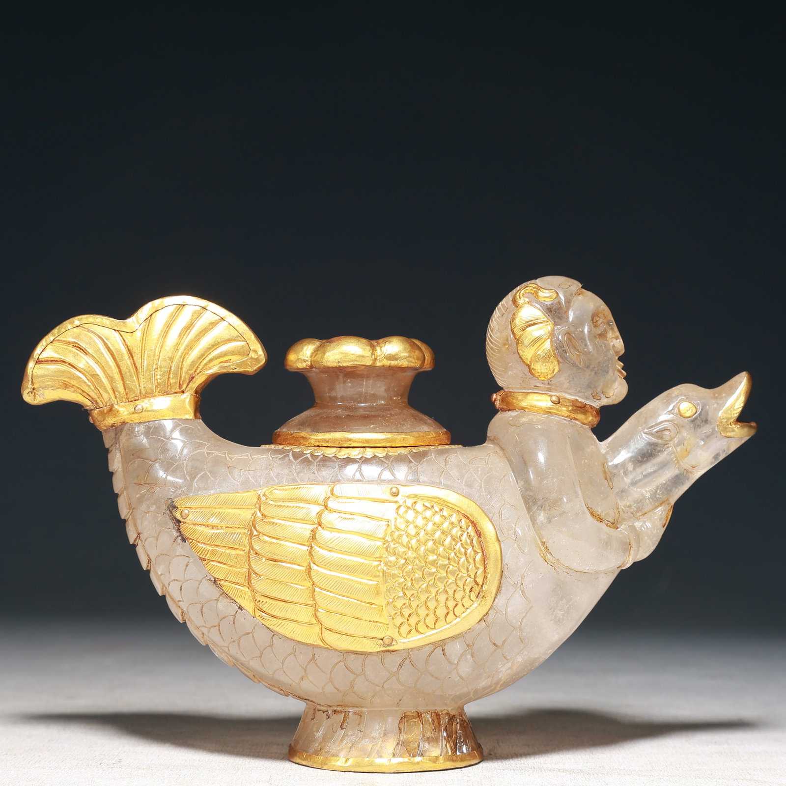 An Exquisite Crystal Cover with Gold Figure-head Goose-Shaped Pot: An Exquisite Crystal Cover with Gold Figure-head Goose-Shaped Pot,Qing Dynasty, China,Size:8.3inx2.8inx5.5in,Weight:1150g 水晶包金人首鹅形壶,È